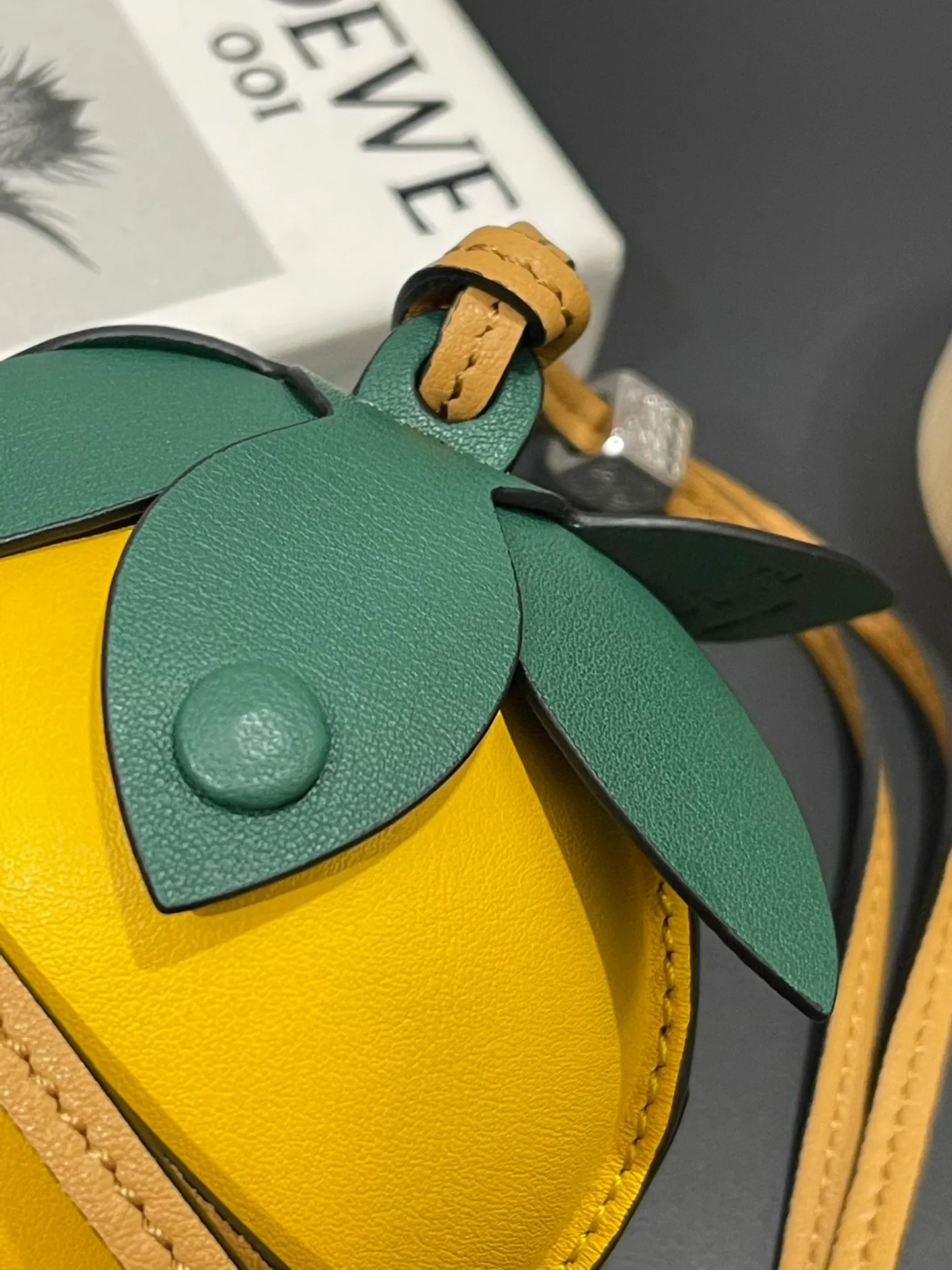 💰880 Passion fruit small bag pendant is made of calfskin with contrasting colors and fastened with snap buttons. It can hold some small items and change inside, and can be hung on the neck or bag.    Style No. 327 Size 12*11 (cards cannot be placed)