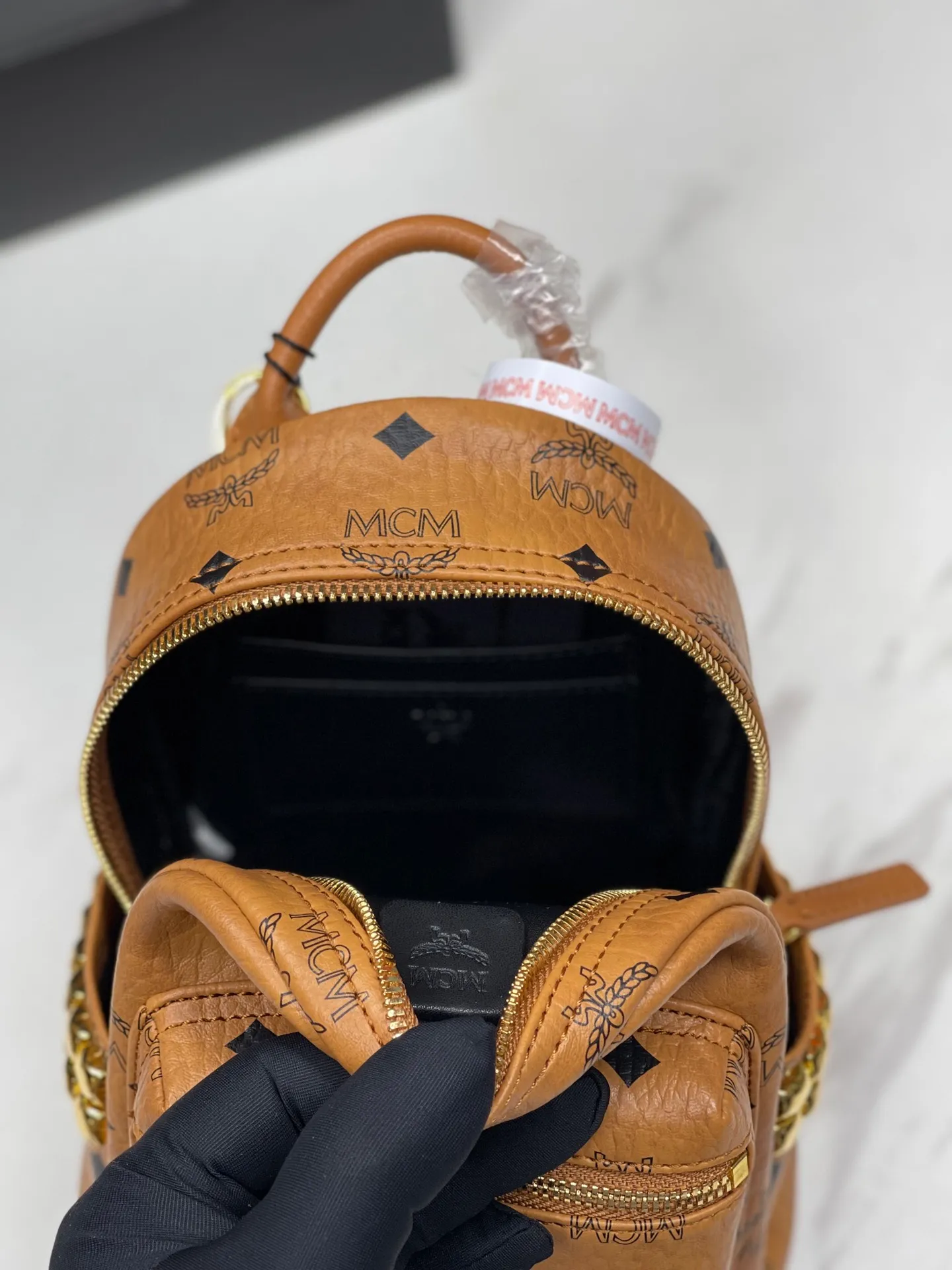 Factory running price 620💰💐Top original quality MCM side stud series [Exclusive real shot] Ultra-mini size coded M9005 piece is made of our signature Visetos coated canvas and lined with luxurious faux leather. The structured design has a spacious interior and pyramid rivet trim to add avant-garde style to your look. Size: The actual super mini size is about 17X21X19