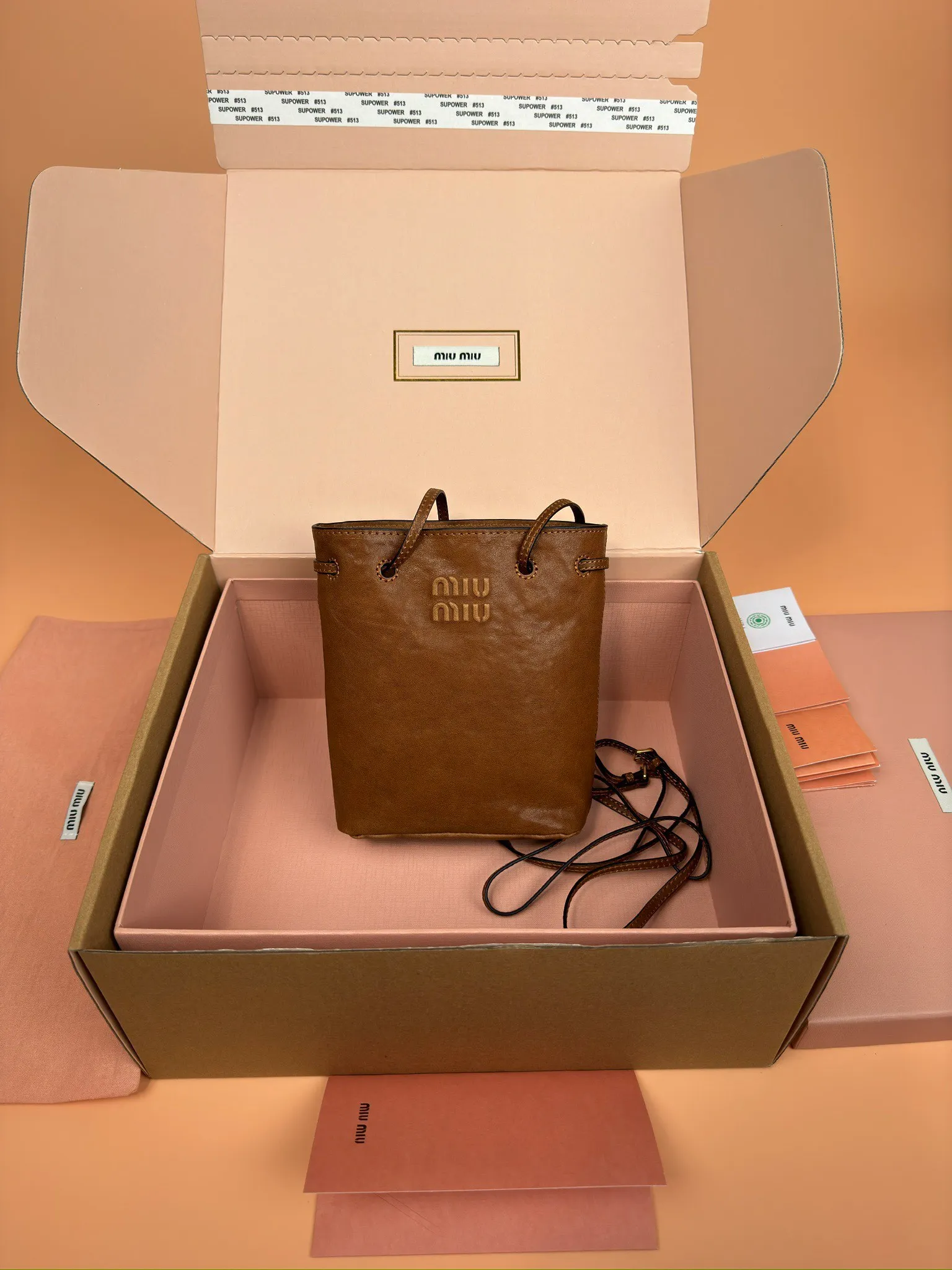 p1040 [Special grade hardware original leather] nappa sheepskin mini handbag shoulder bag ~ brown This mini handbag is famous for the soft texture of nappa sheepskin. Adjustable shoulder strap adds practical detail, while embossed letter logo adds classic style ~ Letter logo ~ Adjustable shoulder strap ~ Lined Model: 5nf460 Dimensions: w14×h17×d6