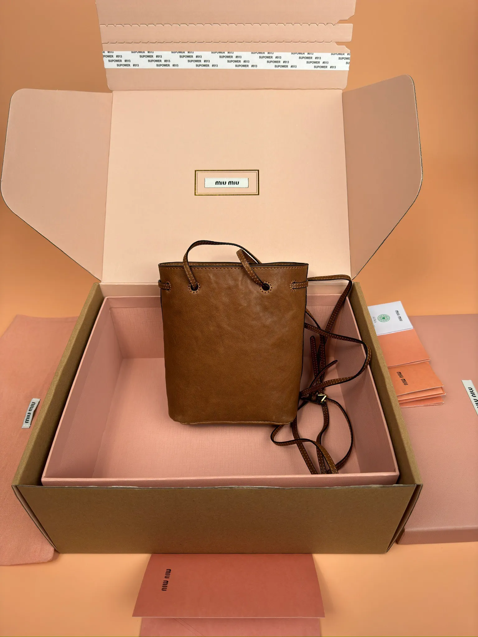 p1040 [Special grade hardware original leather] nappa sheepskin mini handbag shoulder bag ~ brown This mini handbag is famous for the soft texture of nappa sheepskin. Adjustable shoulder strap adds practical detail, while embossed letter logo adds classic style ~ Letter logo ~ Adjustable shoulder strap ~ Lined Model: 5nf460 Dimensions: w14×h17×d6
