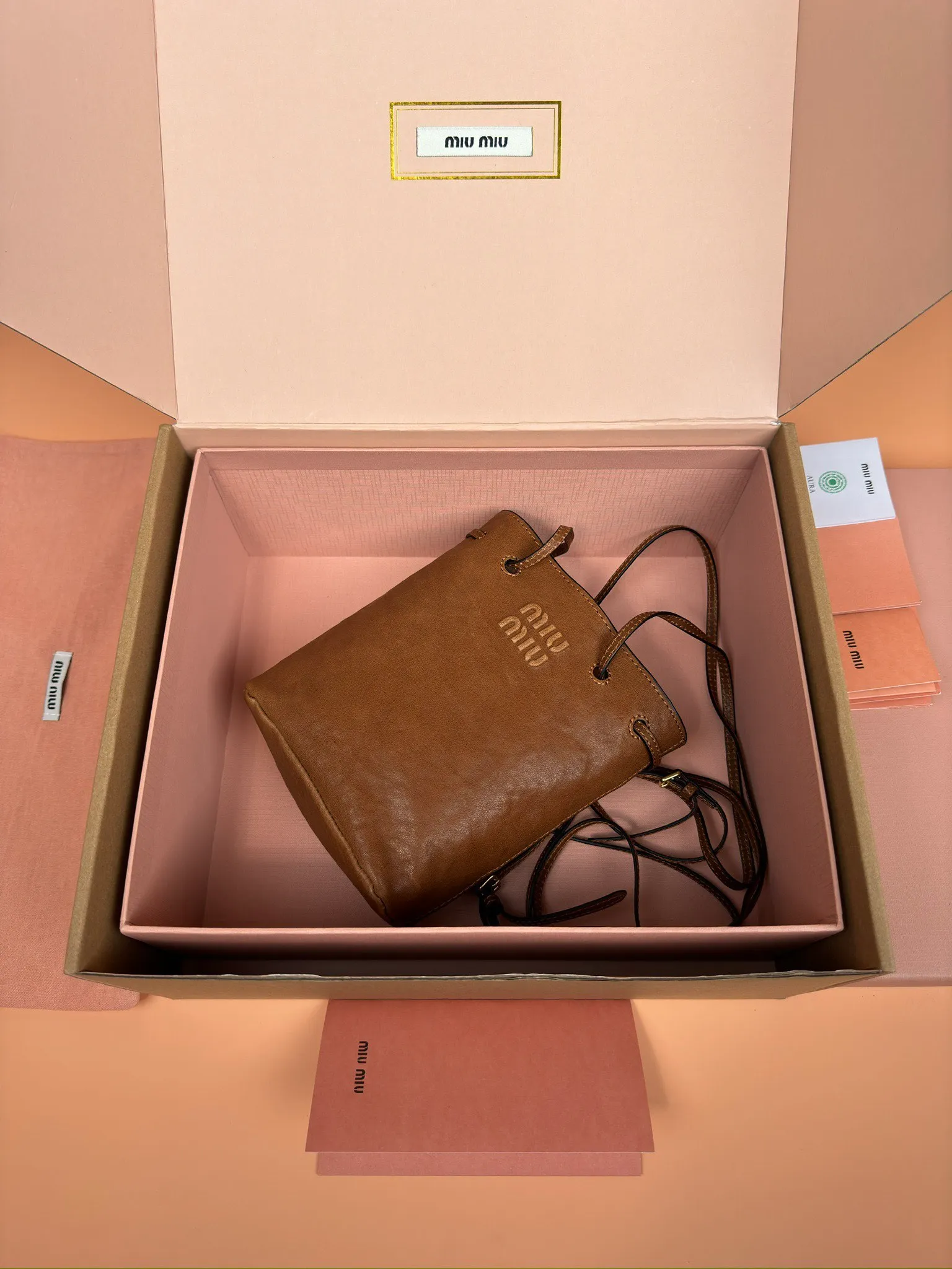 p1040 [Special grade hardware original leather] nappa sheepskin mini handbag shoulder bag ~ brown This mini handbag is famous for the soft texture of nappa sheepskin. Adjustable shoulder strap adds practical detail, while embossed letter logo adds classic style ~ Letter logo ~ Adjustable shoulder strap ~ Lined Model: 5nf460 Dimensions: w14×h17×d6
