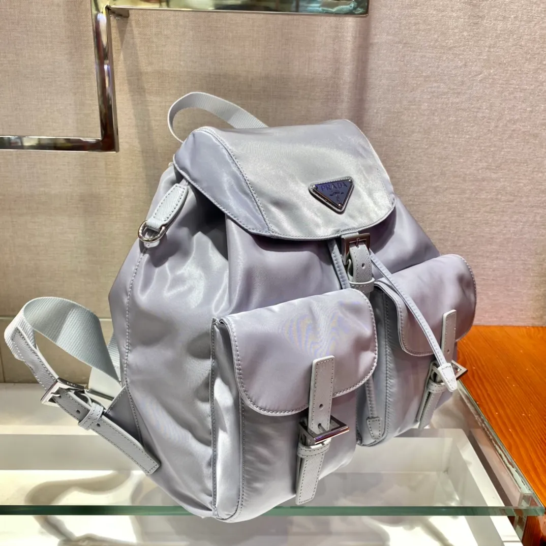 💰1120🎉New Backpack🎉1BZ811👍👍New Color🎉🎉This nylon backpack is trimmed with exquisite Saffiano leather, a blend of multiple materials, and decorated with a triangular logo, highlighting fashionable elegance. It also comes with a detachable small handbag😘😘Light and practical, the upper body effect is super stylish, and it can be matched at will😘😘Fully upgraded nylon fabric👍👍Length 30x Height 32x Bottom 15cm👏👏👏💰💰💰