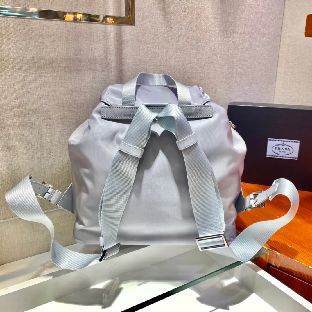 💰1120🎉New Backpack🎉1BZ811👍👍New Color🎉🎉This nylon backpack is trimmed with exquisite Saffiano leather, a blend of multiple materials, and decorated with a triangular logo, highlighting fashionable elegance. It also comes with a detachable small handbag😘😘Light and practical, the upper body effect is super stylish, and it can be matched at will😘😘Fully upgraded nylon fabric👍👍Length 30x Height 32x Bottom 15cm👏👏👏💰💰💰
