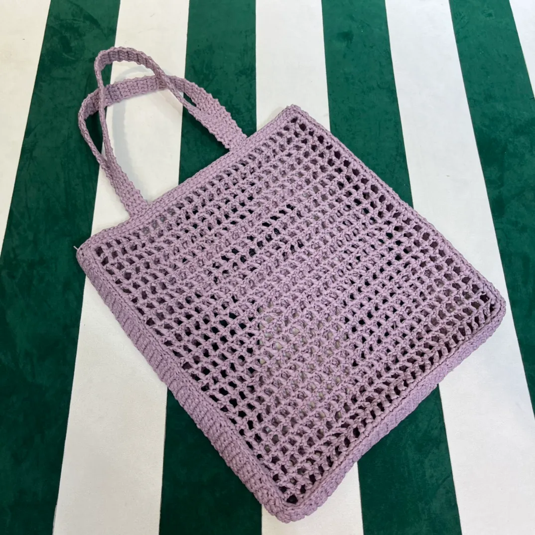 💰1160 Raffia Upgraded Version/Lavender Purple☂️ 𝗣𝗿'𝗮𝗱𝗮Raffia Fiber Tote Bag Made of high-quality imported raffia🌿 Purely handmade! Every craftsman makes it with care and crochets it stitch by stitch! How can summer outings, picnics, and photo shoots be complete without a beautiful, lightweight and chic straw bag? 393 Size: 36×4×38cm