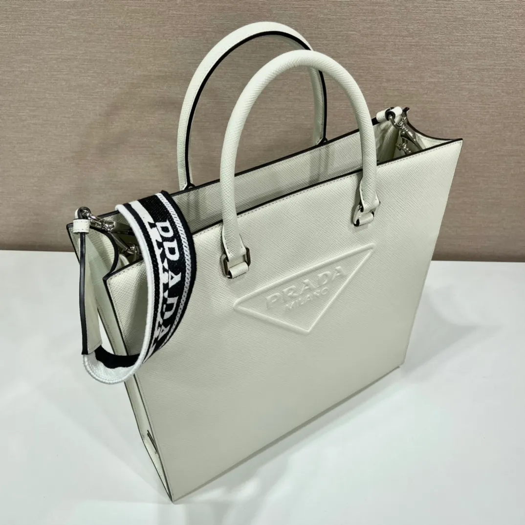💰2040🎉Embroidered webbing tote bag🎉2VG084🎉🎉New color🎉🎉 This stylish and simple tote bag is made of imported Saffiano leather, with a large embossed logo and unique cross parallel lines. My favorite is this detachable embroidered webbing, which can also be matched with other bags🎉🎉Simple and elegant, fashionable, full of street fashion👏👏 Length 37x Height 37x Bottom 9cm