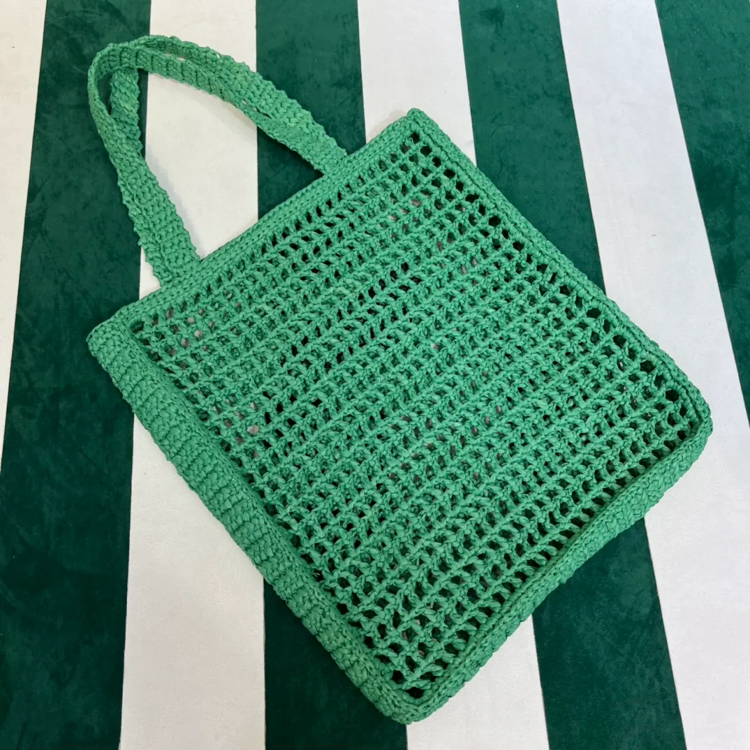 💰1160 Raffia Upgraded Version/Green🌲 𝗣𝗿'𝗮𝗱𝗮Raffia Fiber Tote Bag Made of high-quality imported raffia🌿 Purely handmade! Every craftsman makes it with care and crochets it stitch by stitch! How can summer outings, picnics, and photo shoots be complete without a beautiful, lightweight and chic straw bag? 393 Size: 36×4×38cm