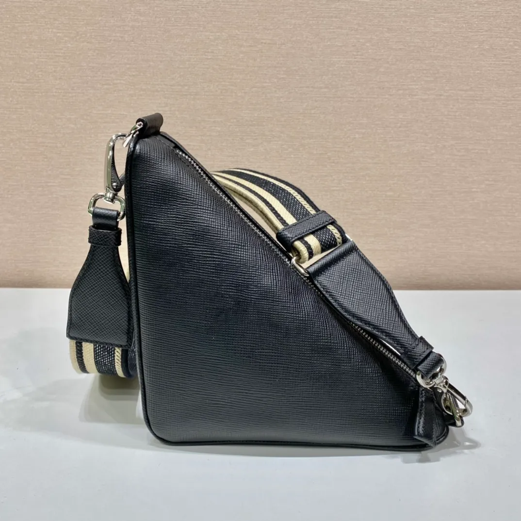 💰1520🎉Embroidered webbing triangle bag🎉2VH155🎉🎉 This triangle bag captures the symbolic geometric shape of the P family. It is made of the brand's iconic Saffiano leather, showing unique cross-parallel features and a large embossed triangle logo. My favorite is this webbing embroidered shoulder strap😘It can be detached to match other bags. The capacity is very large and the feel must be soft👏👏Universal model for men and women🎉🎉, perfect, hurry up and get it🎉🎉 Length 28x Height 18x ​​Bottom 11cm🎉🎉🎉👏👏👏