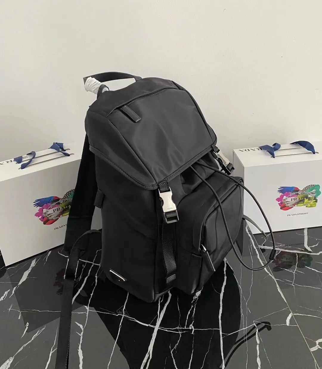 P900¥ [strong], top original quality [celebration] ✨Classic hot style✨ The latest Pr@da men's backpack 2VZ135 Triangular enamel nameplate logo Imported original parachute fabric Using imported equipment ✈️ + original hardware accessories Adjustable nylon shoulder straps Flip strap closure and internal drawstring closure Perfect details on the back padding 😘With OEM code Size 17*27*45 Fashionable and casual, a must-have for fashionistas [deyi][deyi] It will be shipped soon [deyi][deyi]