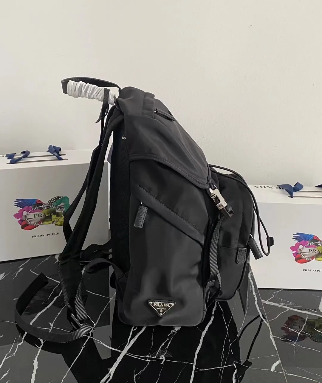 P900¥ [strong], top original quality [celebration] ✨Classic hot style✨ The latest Pr@da men's backpack 2VZ135 Triangular enamel nameplate logo Imported original parachute fabric Using imported equipment ✈️ + original hardware accessories Adjustable nylon shoulder straps Flip strap closure and internal drawstring closure Perfect details on the back padding 😘With OEM code Size 17*27*45 Fashionable and casual, a must-have for fashionistas [deyi][deyi] It will be shipped soon [deyi][deyi]