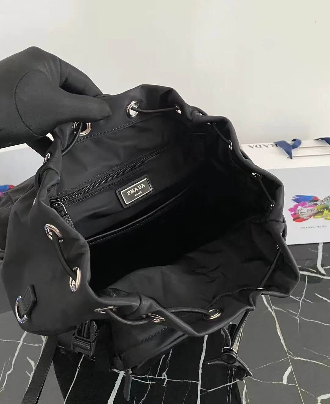 P900¥ [strong], top original quality [celebration] ✨Classic hot style✨ The latest Pr@da men's backpack 2VZ135 Triangular enamel nameplate logo Imported original parachute fabric Using imported equipment ✈️ + original hardware accessories Adjustable nylon shoulder straps Flip strap closure and internal drawstring closure Perfect details on the back padding 😘With OEM code Size 17*27*45 Fashionable and casual, a must-have for fashionistas [deyi][deyi] It will be shipped soon [deyi][deyi]