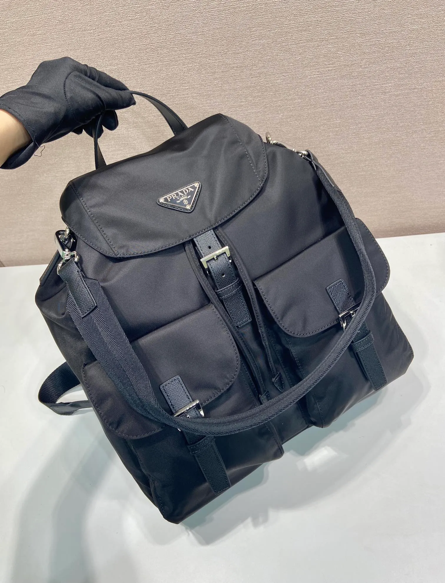 💰1360🎉New Backpack🎉2VZ110A Double Shoulder Strap🎉🎉 This Re-Nylon backpack is designed with classic nylon fabric, top-grade hardware, and integrated with innovative and practical elements, presenting a refined and timeless style. Equipped with a detachable shoulder strap, it can be used interchangeably on different occasions. The upper body effect is very fashionable and elegant, and it is a popular style that will never go out of style🎉Hurry up and get it🎉🎉 Length 34x Height 39x Bottom 15cm🎉🎉🎉🎉👏👏👏