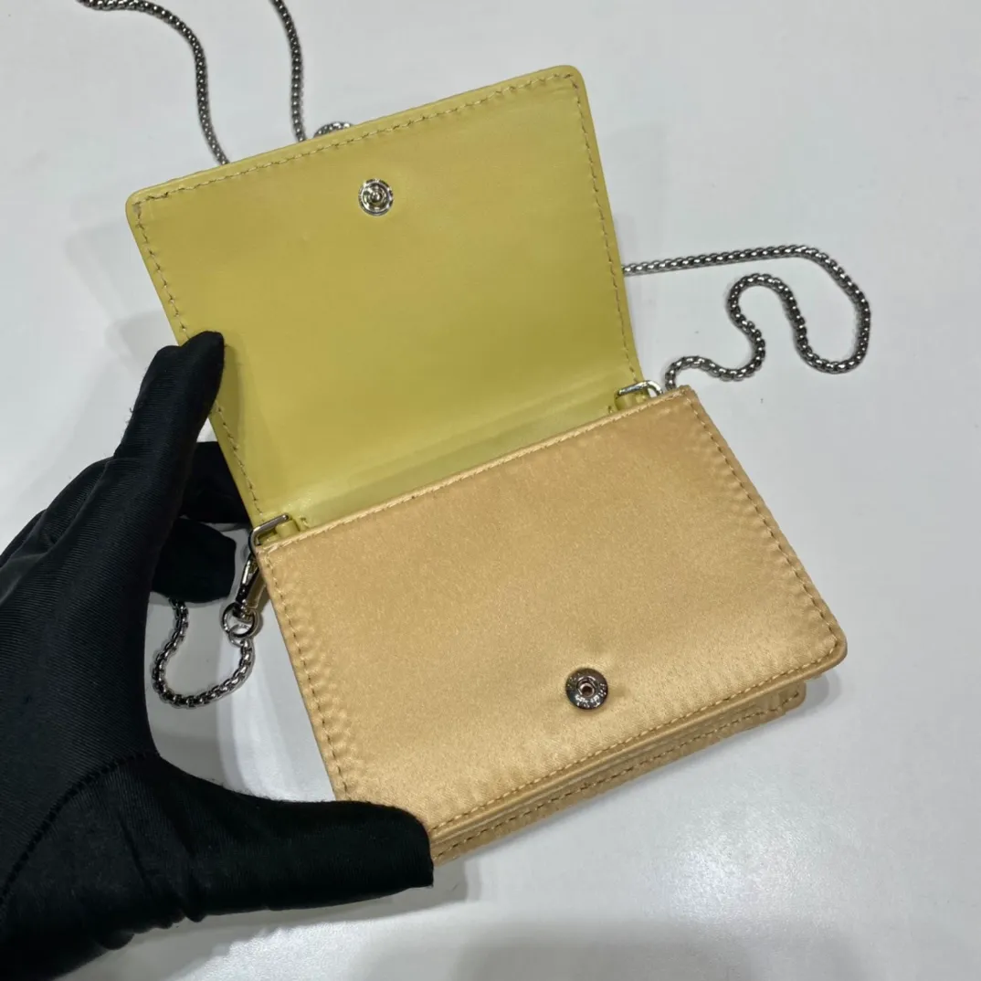 💰760🎉Necklace crystal pouch🎉1MR024 new color🎉🎉 This Duchesse fabric card holder is decorated with imitation crystals throughout, creating a light and shadow style and iridescent colors on the surface, highlighting a gorgeous yet functional design. My favorite is this detachable and adjustable iron shoulder strap, which can be used as a waist bag decoration😍😍 or as a necklace decoration with clothes. The triangle mark in the middle can be adjusted, giving the item a variety of ways to wear it. The space can be used to hold lipstick 💄/earphones/keys🚗....it bling bling under the night light, so beautiful. Worth buying 🎉🎉 Length 11.5x Height 8cm
