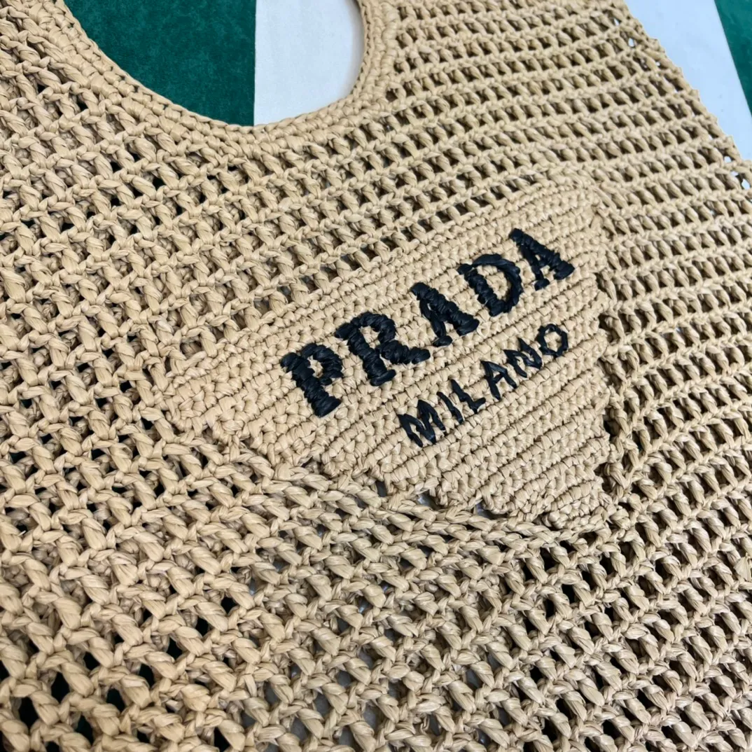 💰1360{Apricot｝🏝 Prad* new hollow straw tote! Full of artistic atmosphere ~ The raffia weave is very solid and has a great texture. ♡ It can be paired with personal clothes every day. The natural style design makes it seem like it can breathe💭 If you like the baby, quickly add it to the harem. Carry an exclusive style that will not go out of style for several years🌱1BG424 Size: Height 45x Width 51cm