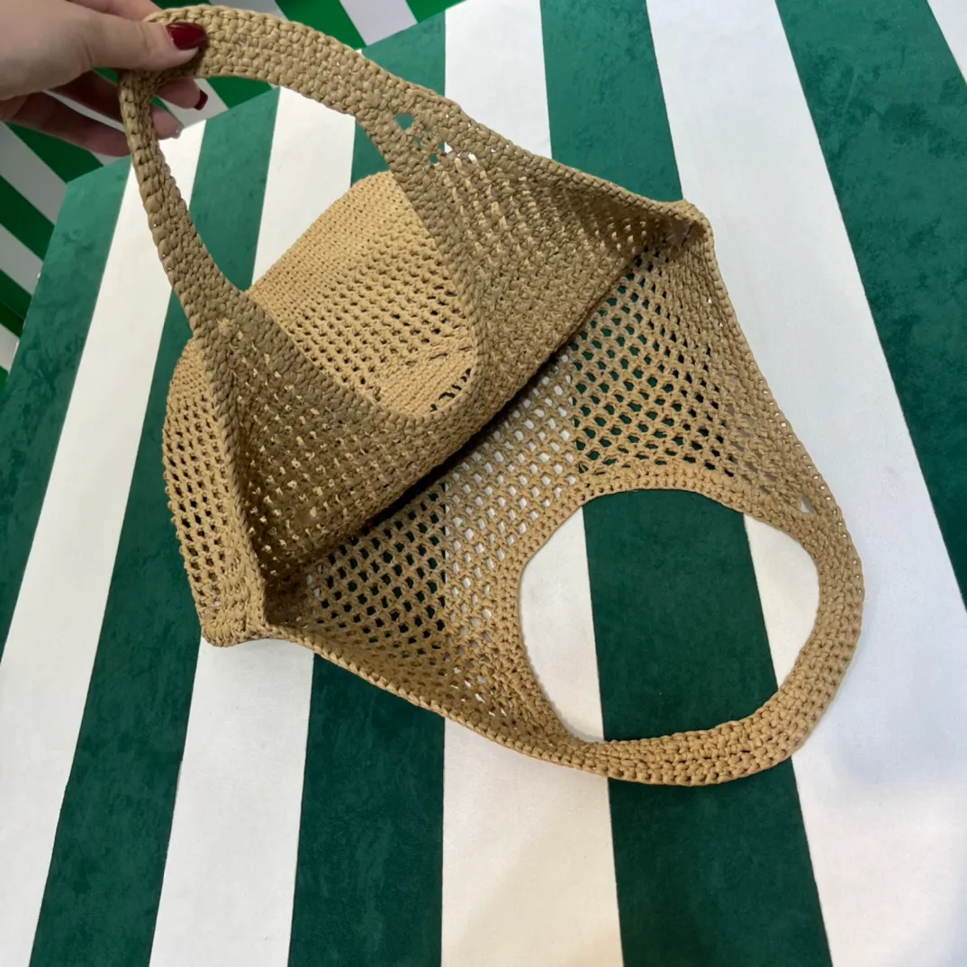 💰1360{Apricot｝🏝 Prad* new hollow straw tote! Full of artistic atmosphere ~ The raffia weave is very solid and has a great texture. ♡ It can be paired with personal clothes every day. The natural style design makes it seem like it can breathe💭 If you like the baby, quickly add it to the harem. Carry an exclusive style that will not go out of style for several years🌱1BG424 Size: Height 45x Width 51cm