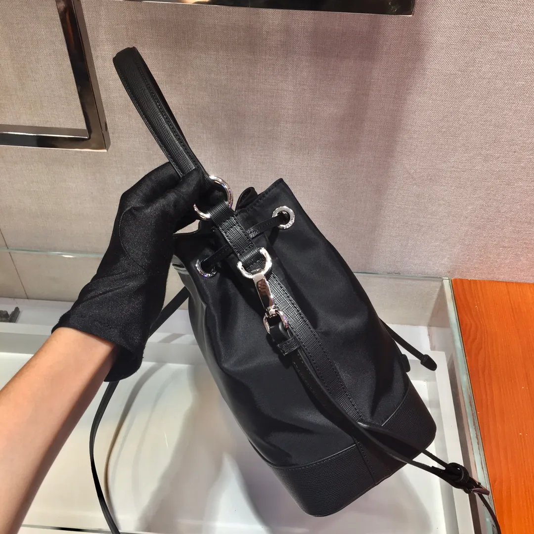 💰1060🎉New bucket bag🎉1BE055🎉Nylon bucket bag🎉🎉, made of imported nylon fabric/cross pattern cowhide, leather handle, detachable long shoulder strap , drawstring bag mouth, this combination is light and fashionable, has a very large capacity, and is a bucket bag that will never go out of style🙊🙊Ladies, it is worth owning, hurry up and get it🎉🎉 Length 24x Height 23x Bottom 12cm