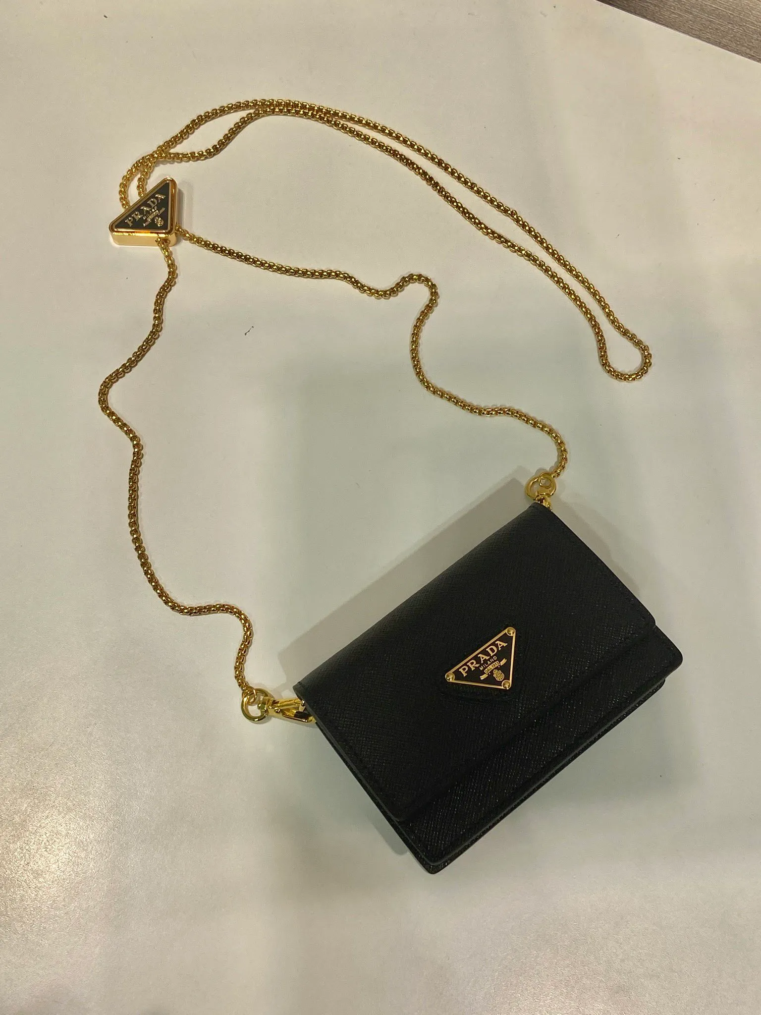 🎉Chain Card Holder🎉1MR024 Mini🎉🎉 This exquisite and versatile flip card holder is equipped with a detachable chain shoulder strap, which adds gorgeous style and is easy to carry in a variety of ways. It can also be used as a waist bag👍The metal engraved logo decorates the front material of the Saffiano leather jacket, which is fashionable and versatile. It can accommodate lipstick, keys, and cards. It’s so cute😘babies. Come in quickly😘😘 Length 11.5x height 8x base 2.5cm🎉🎉🎉💰💰💰