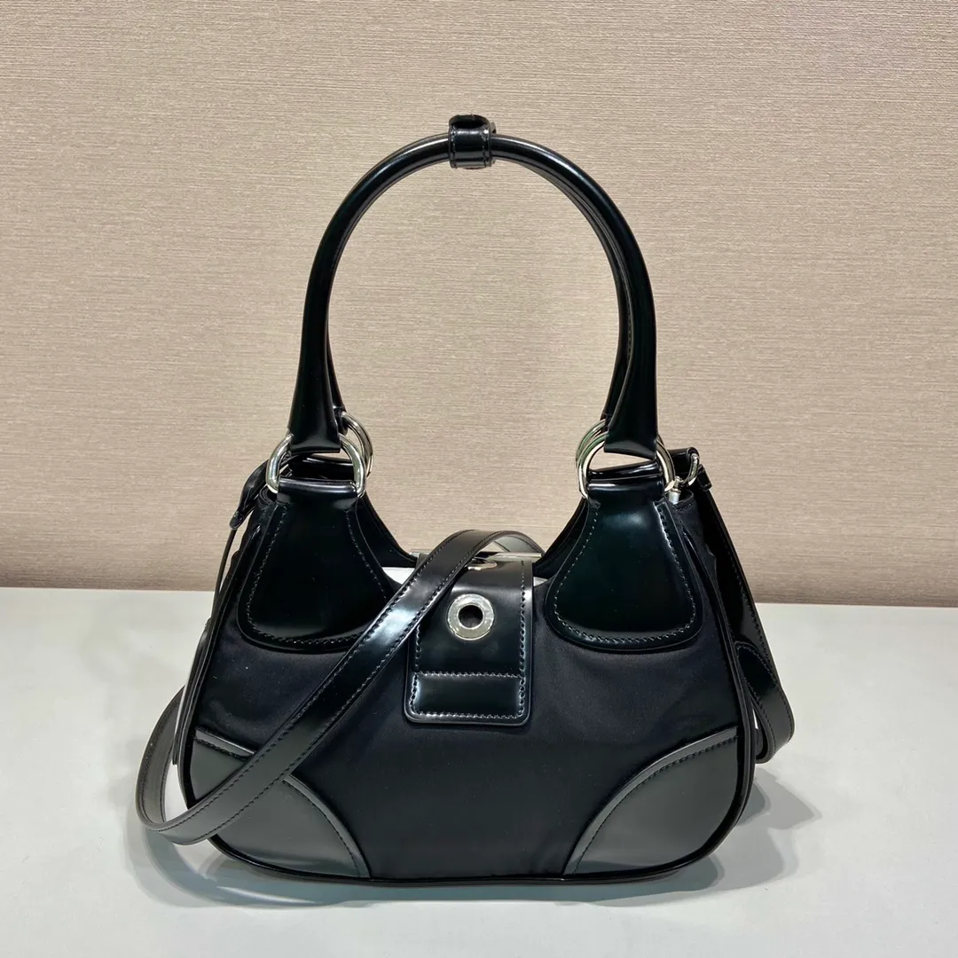 💰1320🎉Moon handbag🎉1BA381 new model🎉🎉 This Moon handbag is made of imported nylon fabric and glossy cowhide design. It is equipped with a 100 cm detachable and adjustable leather long shoulder strap, which can be carried by hand or on the shoulder, a detachable leather keychain, and a triangle logo magnetic buckle/lace closure on the front. It is lightweight and practical, and has a cool/fashionable upper body effect. Another popular style that will never go out of style🎉🎉Hurry up and get it🎉 Length 22.5x Height 16x Bottom 7.5cm