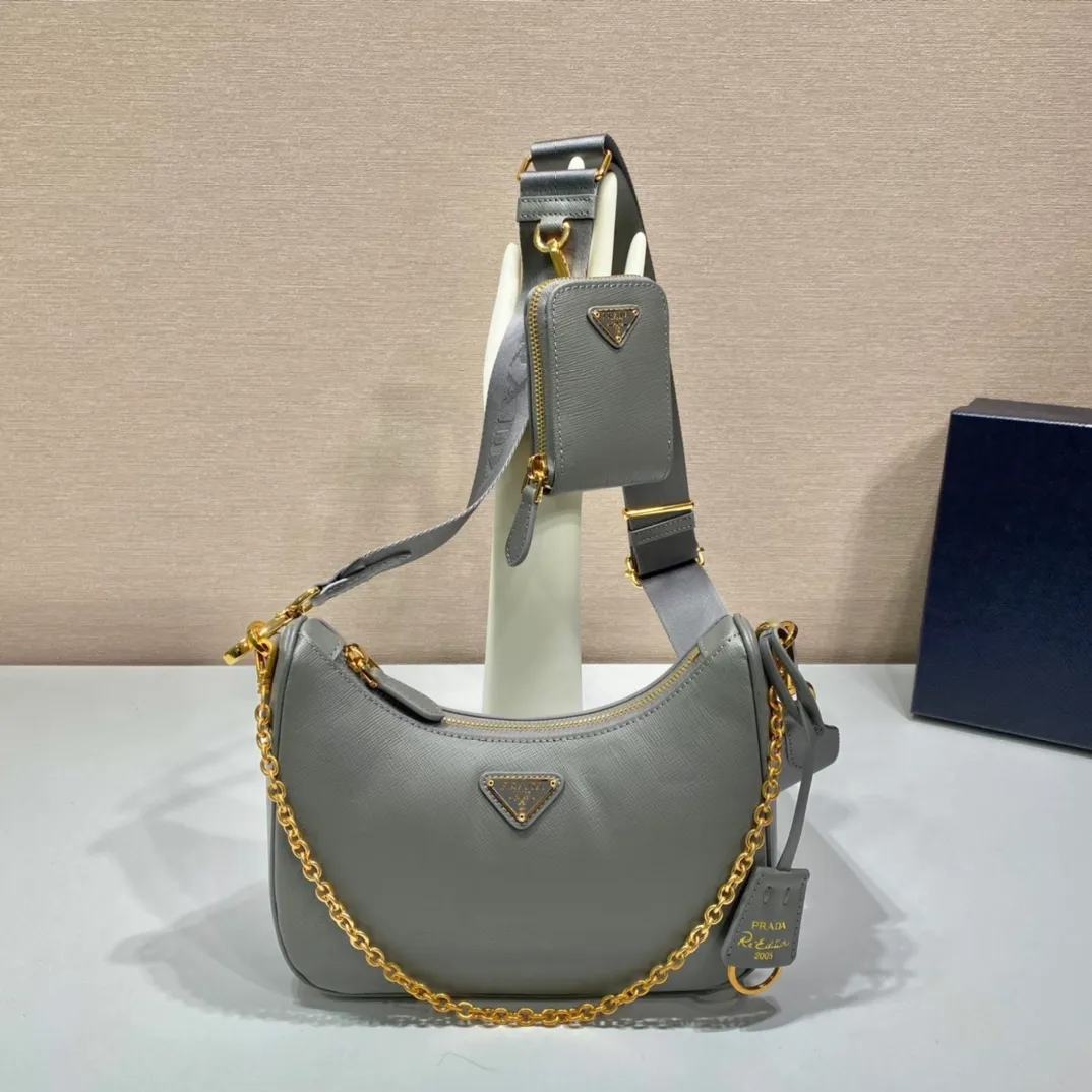 💰1500🎊Gold hardware three-in-one🎊New model 1BH204 full leather/gold hardware, nylon Hobo hand/armpit bag😘😘The full leather hobo that is popular in the fashion circle due to the crazy cultivation of the Internet celebrity sister group has a new model! 👏👏The design of this all-leather Hobo bag is great👍👍One bag with three uses😘😘waist bag/crossbody/single shoulder bag👍👍The handle is replaced by a chain, which makes the underarm bag a little more sexy. It also has a long shoulder strap. What I love most is that there is a small pendant (small bag) hanging on the shoulder strap, which can also be hung on other bags and pants as accessories. 🙊🙊There is no problem in matching various clothes in normal times😘😘Babies, hurry up and get it, it’s so beautiful🙊🙊Dimensions: length 23x height 17x bottom 6.5cm👏👏👏