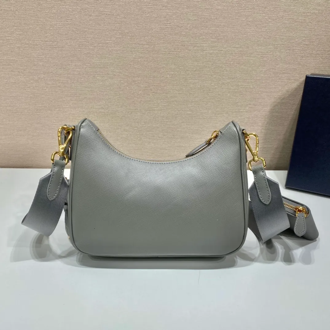 💰1500🎊Gold hardware three-in-one🎊New model 1BH204 full leather/gold hardware, nylon Hobo hand/armpit bag😘😘The full leather hobo that is popular in the fashion circle due to the crazy cultivation of the Internet celebrity sister group has a new model! 👏👏The design of this all-leather Hobo bag is great👍👍One bag with three uses😘😘waist bag/crossbody/single shoulder bag👍👍The handle is replaced by a chain, which makes the underarm bag a little more sexy. It also has a long shoulder strap. What I love most is that there is a small pendant (small bag) hanging on the shoulder strap, which can also be hung on other bags and pants as accessories. 🙊🙊There is no problem in matching various clothes in normal times😘😘Babies, hurry up and get it, it’s so beautiful🙊🙊Dimensions: length 23x height 17x bottom 6.5cm👏👏👏