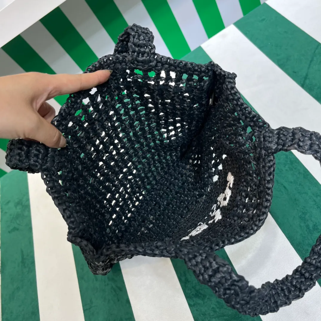 💰1160 Raffia Upgraded Version/Black🎱 𝗣𝗿'𝗮𝗱𝗮Raffia Fiber Tote Bag Made of high-quality imported raffia🌿 Purely handmade! Every craftsman makes it with care and crochets it stitch by stitch! How can summer outings, picnics, and photo shoots be complete without a beautiful, lightweight and chic straw bag? 393 Size: 36×4×38cm