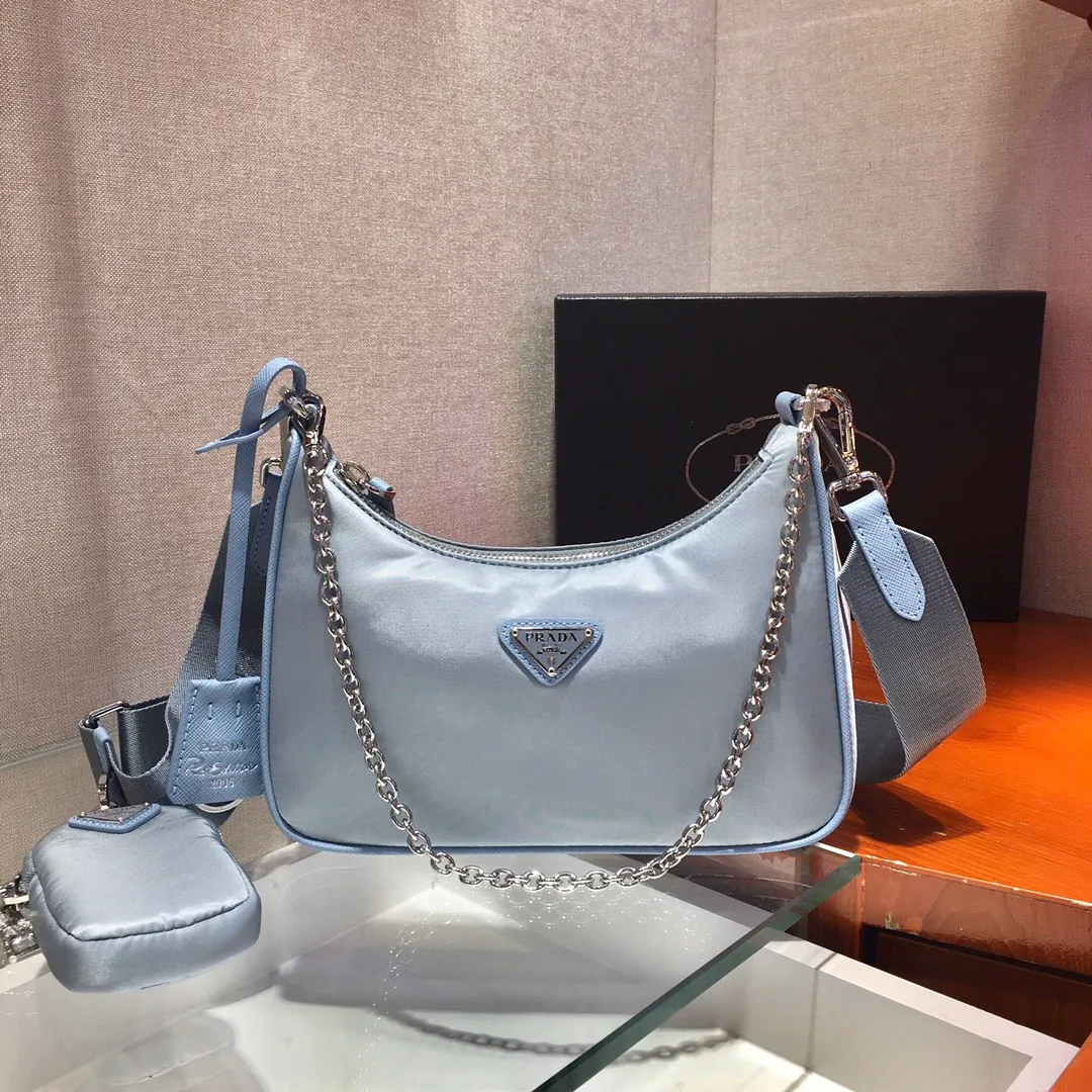 ✨Breaking hot new colors✨🎉New model 1BH204, nylon Hobo handbag/underarm bag😘😘Hobo, which is popular in the fashion circle due to the crazy cultivation of internet celebrity sisters, has a new model! 👏👏The design of this Hobo bag is great👍👍One bag with three uses😘😘waist bag/crossbody/single shoulder bag👍👍The handle is replaced by a chain. When the armpit bag is a little more sexy, it is also equipped with a long shoulder strap. What I love most is that the shoulder strap also has a small pendant (small bag), which can also be hung with other bags and pants as accessories. 🙊🙊There is no problem in matching various clothes in normal times😘😘Babies, hurry up and get it, it’s so beautiful🙊🙊Dimensions: Length 22X Height 12x Bottom 6cm👏👏👏💰💰💰 P1000