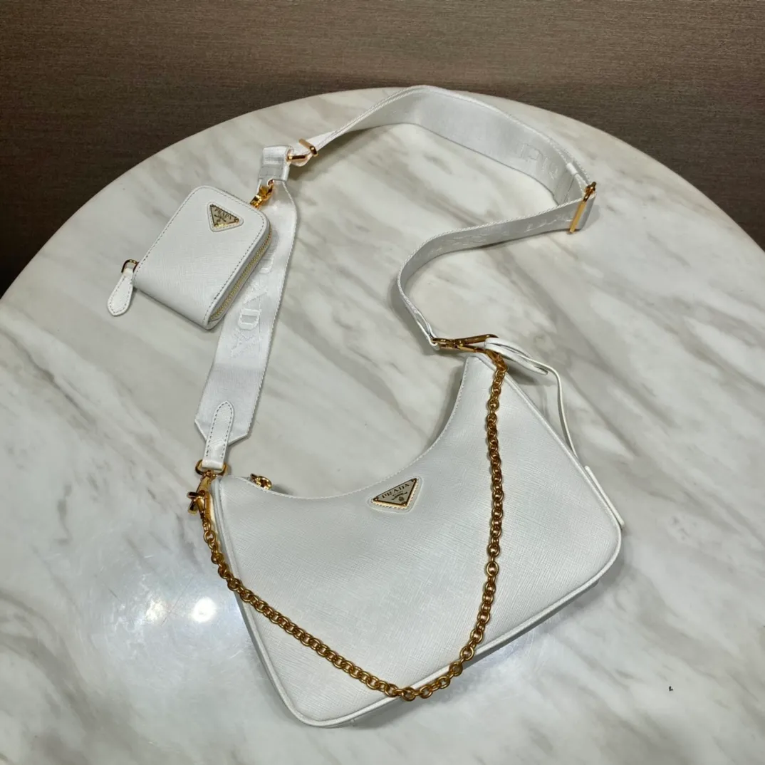 💰1500🎊Gold hardware three-in-one🎊New color 1BH204 full leather/gold hardware, nylon Hobo hand/armpit bag😘😘The full leather hobo that is popular in the fashion circle due to the crazy cultivation of the Internet celebrity sister group has a new model! 👏👏The design of this all-leather Hobo bag is great👍👍One bag with three uses😘😘waist bag/crossbody/single shoulder bag👍👍The handle is replaced by a chain, which makes the underarm bag a little more sexy. It also has a long shoulder strap. What I love most is that there is a small pendant (small bag) hanging on the shoulder strap, which can also be hung on other bags and pants as accessories. 🙊🙊There is no problem in matching various clothes in normal times😘😘Babies, hurry up and get it, it’s so beautiful🙊🙊Dimensions: length 23x height 17x bottom 6.5cm👏👏👏💰💰💰