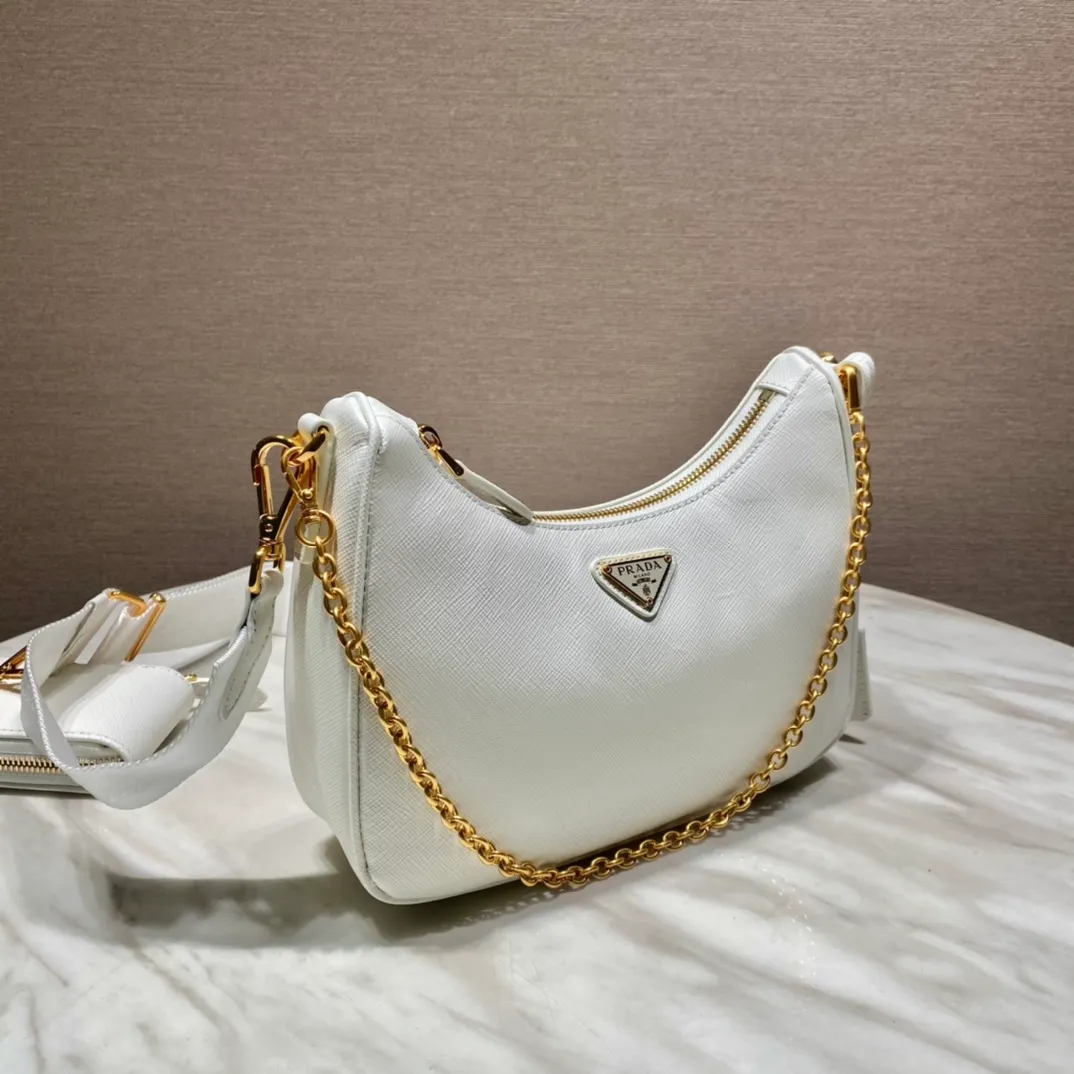 💰1500🎊Gold hardware three-in-one🎊New color 1BH204 full leather/gold hardware, nylon Hobo hand/armpit bag😘😘The full leather hobo that is popular in the fashion circle due to the crazy cultivation of the Internet celebrity sister group has a new model! 👏👏The design of this all-leather Hobo bag is great👍👍One bag with three uses😘😘waist bag/crossbody/single shoulder bag👍👍The handle is replaced by a chain, which makes the underarm bag a little more sexy. It also has a long shoulder strap. What I love most is that there is a small pendant (small bag) hanging on the shoulder strap, which can also be hung on other bags and pants as accessories. 🙊🙊There is no problem in matching various clothes in normal times😘😘Babies, hurry up and get it, it’s so beautiful🙊🙊Dimensions: length 23x height 17x bottom 6.5cm👏👏👏💰💰💰