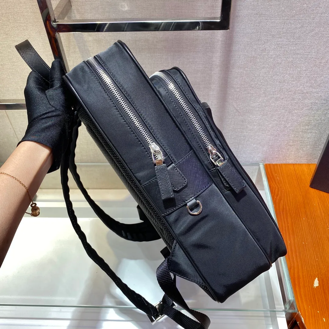 💰1260🎉New Backpack🎉2VZ064🎉This nylon backpack is equipped with multiple practical pockets and complements the modern and fashionable minimalist design. A triangular metal logo adorns it like a finishing touch. Made of nylon, trimmed with Saffiano leather, multiple zippers for external openings, top-grade hardware, many compartments, practical and elegant🙊The upper body effect is very cool👏, if you like babies, hurry up and get it, it is another backpack that will never go out of style🎉🎉 Length 26x Height 35x Bottom 12cm
