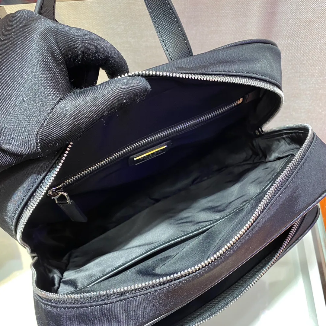 💰1260🎉New Backpack🎉2VZ064🎉This nylon backpack is equipped with multiple practical pockets and complements the modern and fashionable minimalist design. A triangular metal logo adorns it like a finishing touch. Made of nylon, trimmed with Saffiano leather, multiple zippers for external openings, top-grade hardware, many compartments, practical and elegant🙊The upper body effect is very cool👏, if you like babies, hurry up and get it, it is another backpack that will never go out of style🎉🎉 Length 26x Height 35x Bottom 12cm