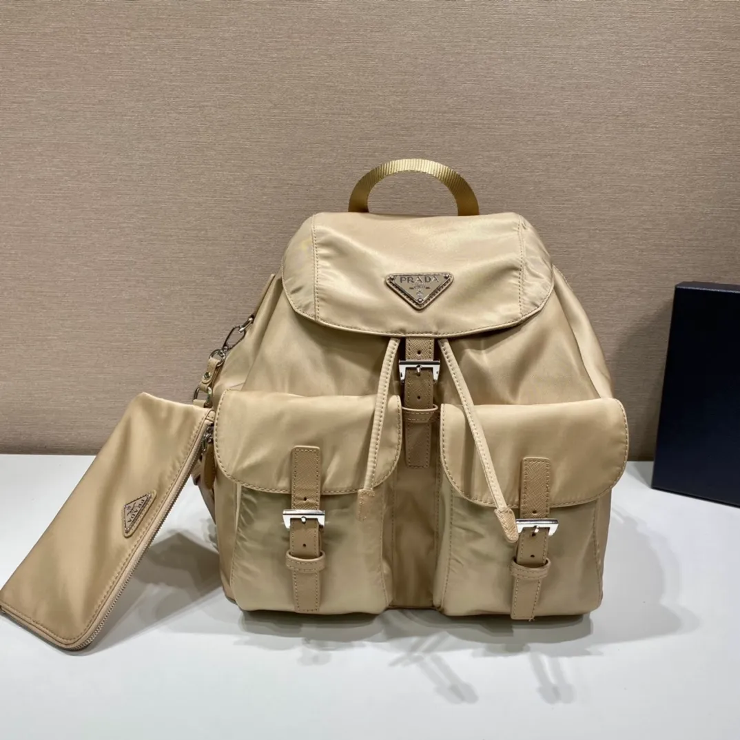 💰1120🎉New Backpack🎉1BZ811👍👍New Color🎉🎉This nylon backpack is trimmed with exquisite Saffiano leather, a blend of multiple materials, and decorated with a triangular logo, highlighting fashionable elegance. It also comes with a detachable small handbag😘😘Light and practical, the upper body effect is super stylish, and it can be matched at will😘😘Fully upgraded nylon fabric👍👍Length 30x Height 32x Bottom 15cm👏👏👏💰💰💰
