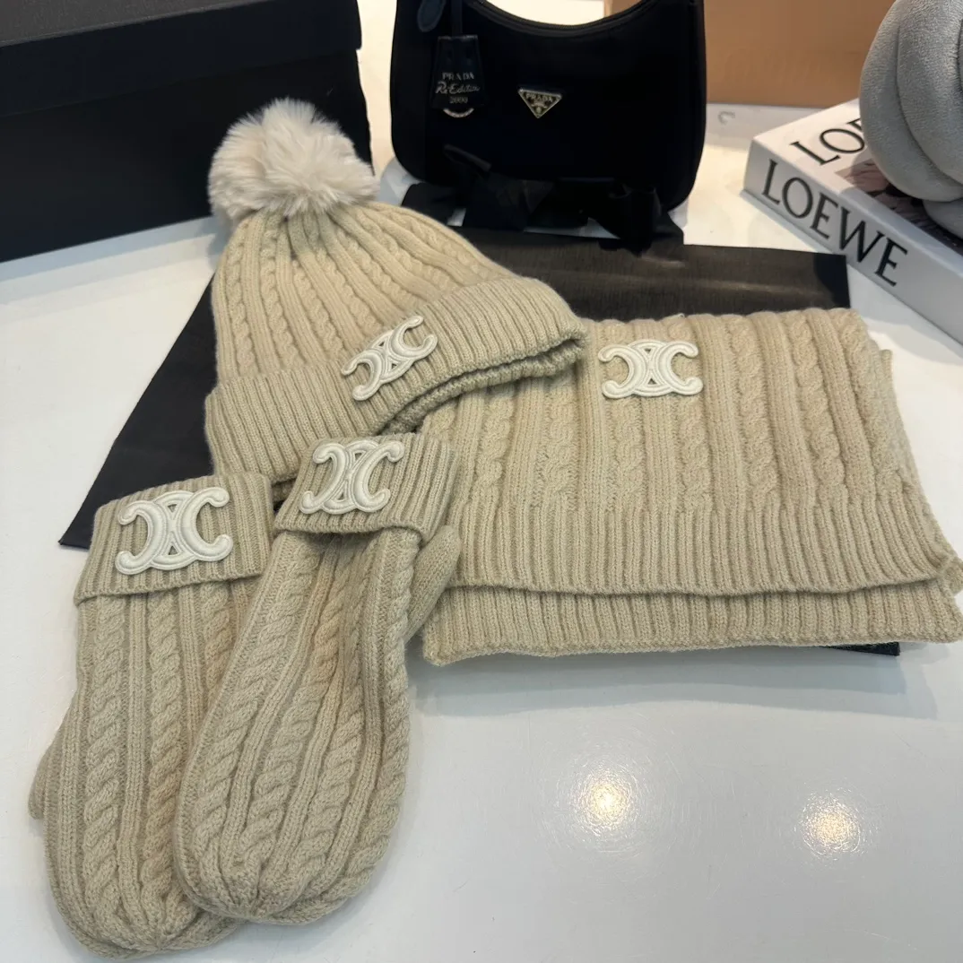 P190 CELINE [Wool Suit Scarf + Gloves + Hat -] Classic suit hat wool cashmere knitted hat with gloves, warm and super comfortable for winter. Celine's three-piece set of gloves, scarves and hats is so high-end. It feels particularly delicate, with impeccable texture and quality. The details are also handled very well. It's warm and comfortable. It's a magical tool for young ladies to reduce their age. Warm and fashionable! Scarf: 185/35cm, head circumference around 57cm, contains 70% wool fabric, complete internal standards.  The latest technology, one-piece molding, is super beautiful. The autumn and winter wool knitted beanie feels good to the touch ~ the color is super white ~ and it has a good atmosphere when taking photos. Multiple colors are matched and very versatile ~