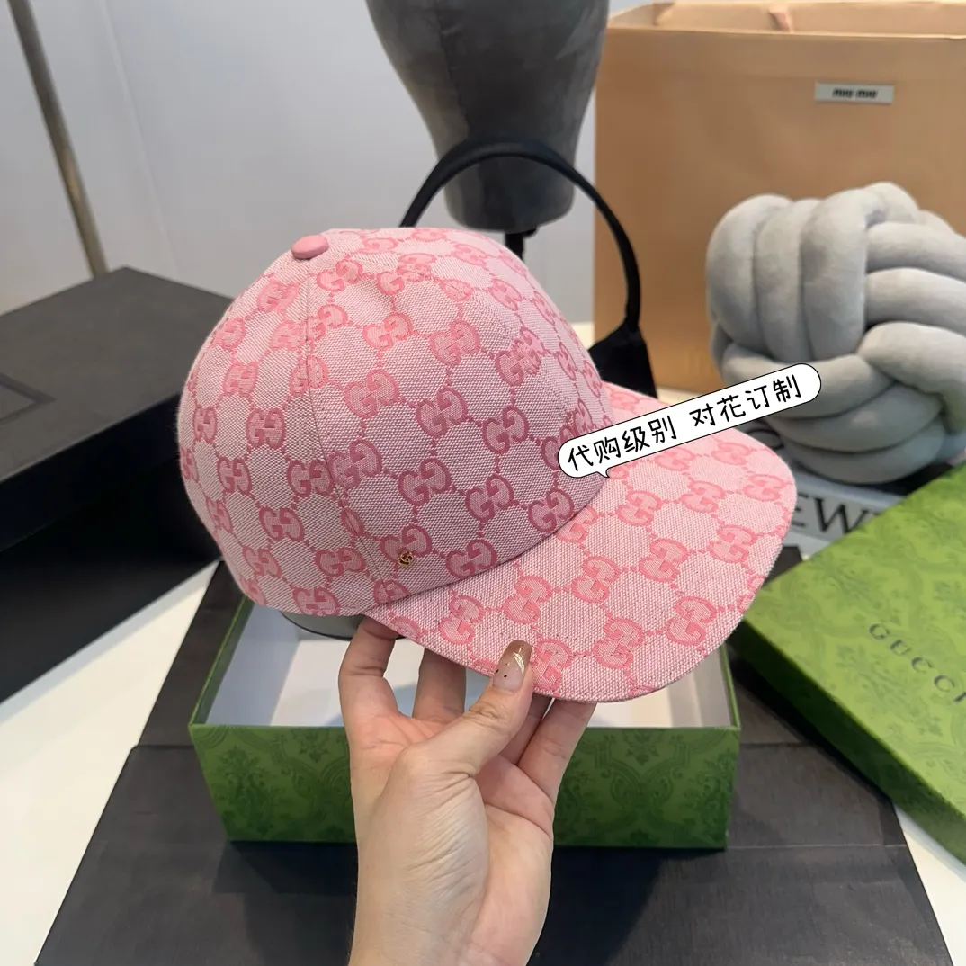 P240 Gucci Baseball Cap🧢Gucci’s classic pattern shines in this fashionable item embellished with the brand’s logo. This baseball cap is crafted from the brand's recognizable GG canvas fabric, with tonal leather details and an adjustable buckle adding to the appeal. Product details ·Pink GG canvas ·Pink leather piping ·Cotton and linen lining ·Adjustable Velcro closure ·70% cotton, 30% polyester; 65% cotton, 35% linen (lining); 55% cotton, 45% viscose (inside); Cow leather (detail); Cow leather (leather piping)