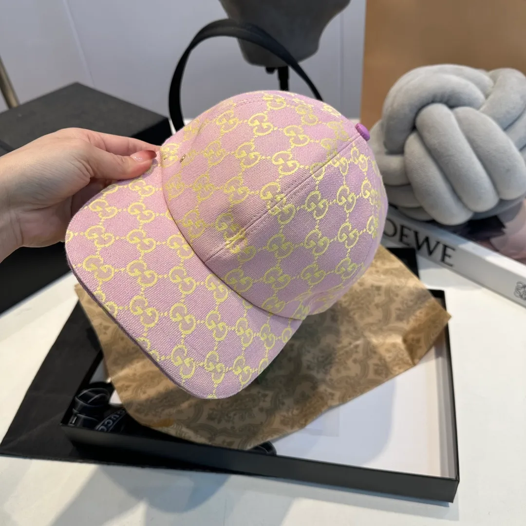 P240 Gucci Baseball Cap🧢Gucci’s classic pattern shines in this fashionable item embellished with the brand’s logo. This baseball cap is crafted from the brand's recognizable GG canvas fabric, with tonal leather details and an adjustable buckle adding to the appeal. Product details ·Pink GG canvas ·Pink leather piping ·Cotton and linen lining ·Adjustable Velcro closure ·70% cotton, 30% polyester; 65% cotton, 35% linen (lining); 55% cotton, 45% viscose (inside); Cow leather (detail); Cow leather (leather piping)