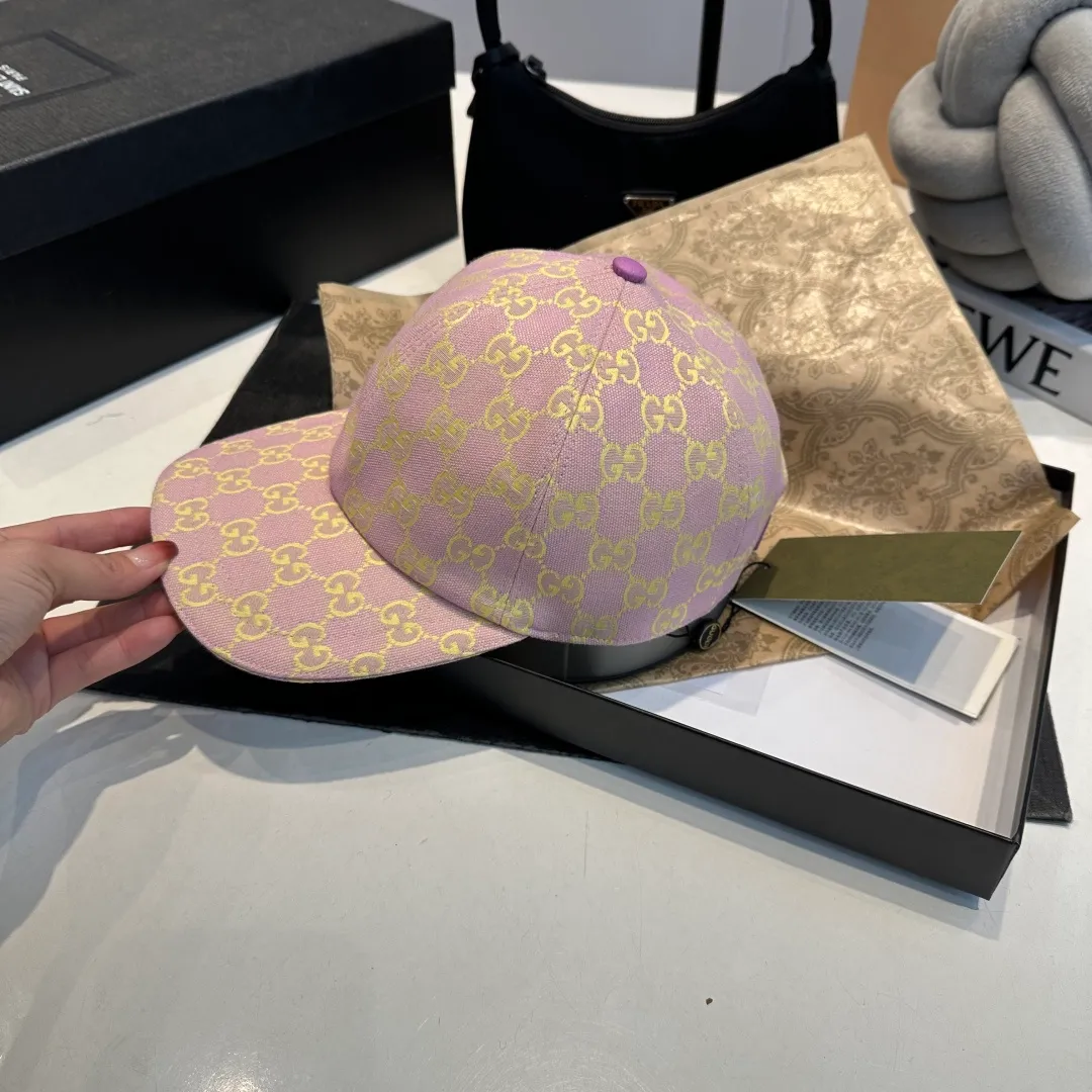 P240 Gucci Baseball Cap🧢Gucci’s classic pattern shines in this fashionable item embellished with the brand’s logo. This baseball cap is crafted from the brand's recognizable GG canvas fabric, with tonal leather details and an adjustable buckle adding to the appeal. Product details ·Pink GG canvas ·Pink leather piping ·Cotton and linen lining ·Adjustable Velcro closure ·70% cotton, 30% polyester; 65% cotton, 35% linen (lining); 55% cotton, 45% viscose (inside); Cow leather (detail); Cow leather (leather piping)