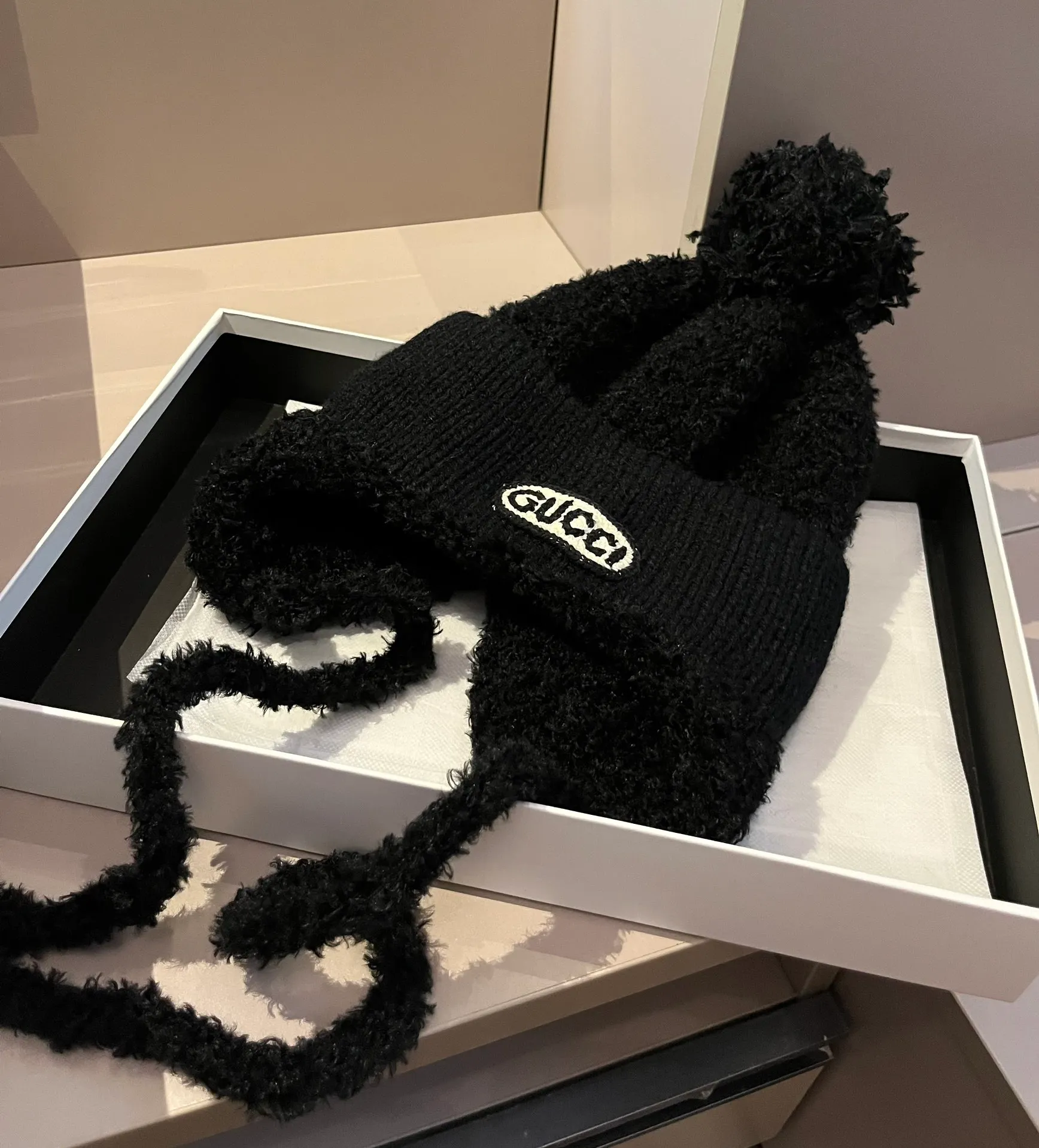 Gucci knitted ear protection beanie