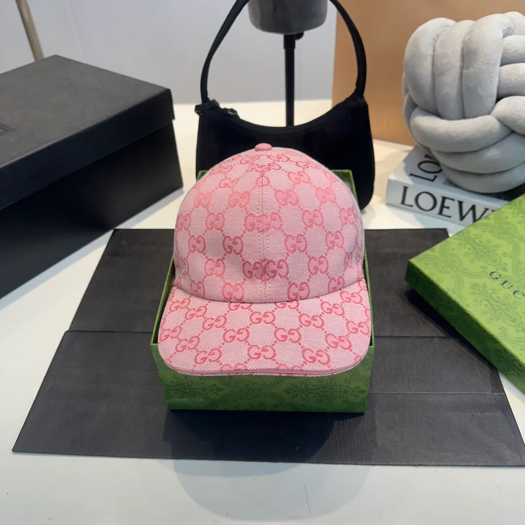 P240 Gucci Baseball Cap🧢Gucci’s classic pattern shines in this fashionable item embellished with the brand’s logo. This baseball cap is crafted from the brand's recognizable GG canvas fabric, with tonal leather details and an adjustable buckle adding to the appeal. Product details ·Pink GG canvas ·Pink leather piping ·Cotton and linen lining ·Adjustable Velcro closure ·70% cotton, 30% polyester; 65% cotton, 35% linen (lining); 55% cotton, 45% viscose (inside); Cow leather (detail); Cow leather (leather piping)