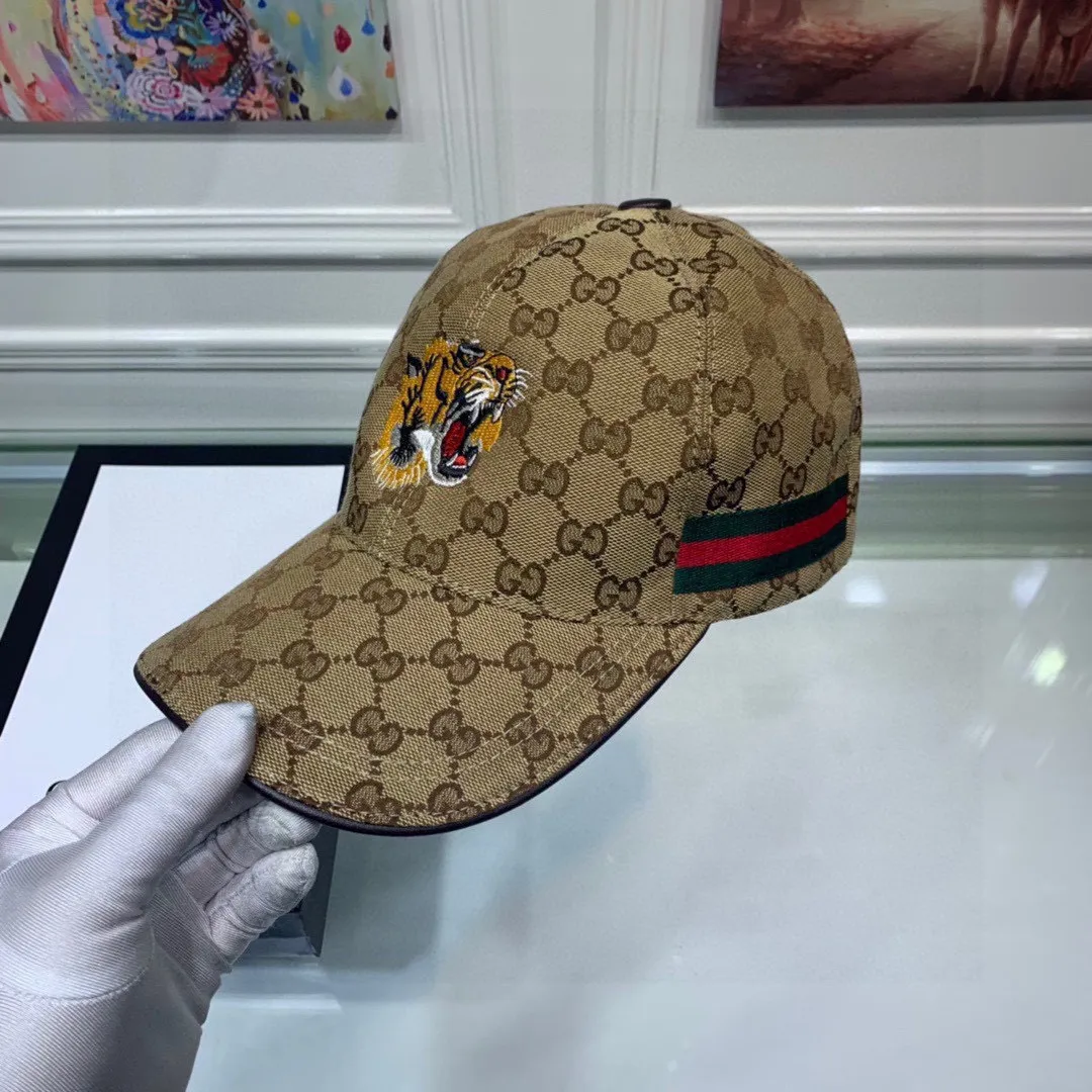 🉐130 Gucci (Gucci) new original baseball cap, tiger head embroidery, 1:1 mold customization, heavy embroidery, details comparable to counters, original canvas + first-layer cowhide, excellent quality! The first choice for handsome men and beautiful women, fashionable and versatile. The basic head circumference is 56cm, and the patch is adjustable.