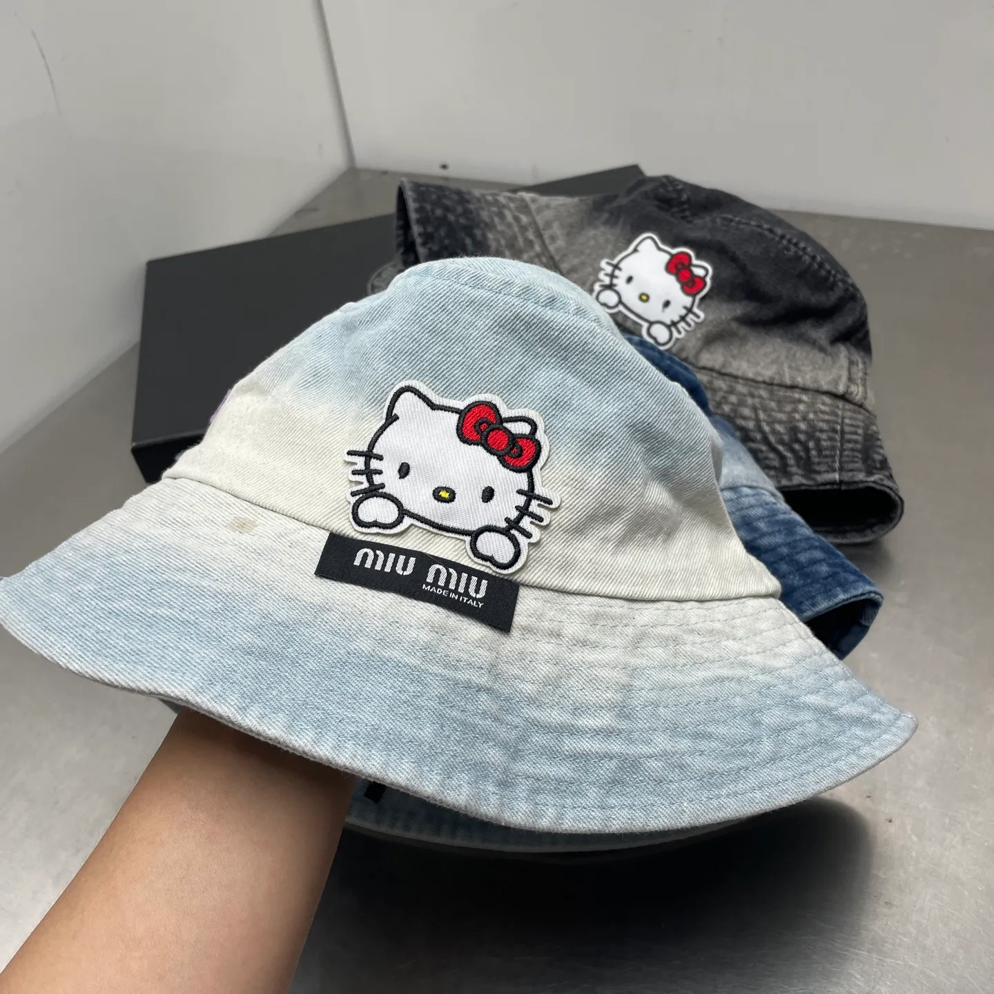 kitty Miumiu gradient denim bucket hat