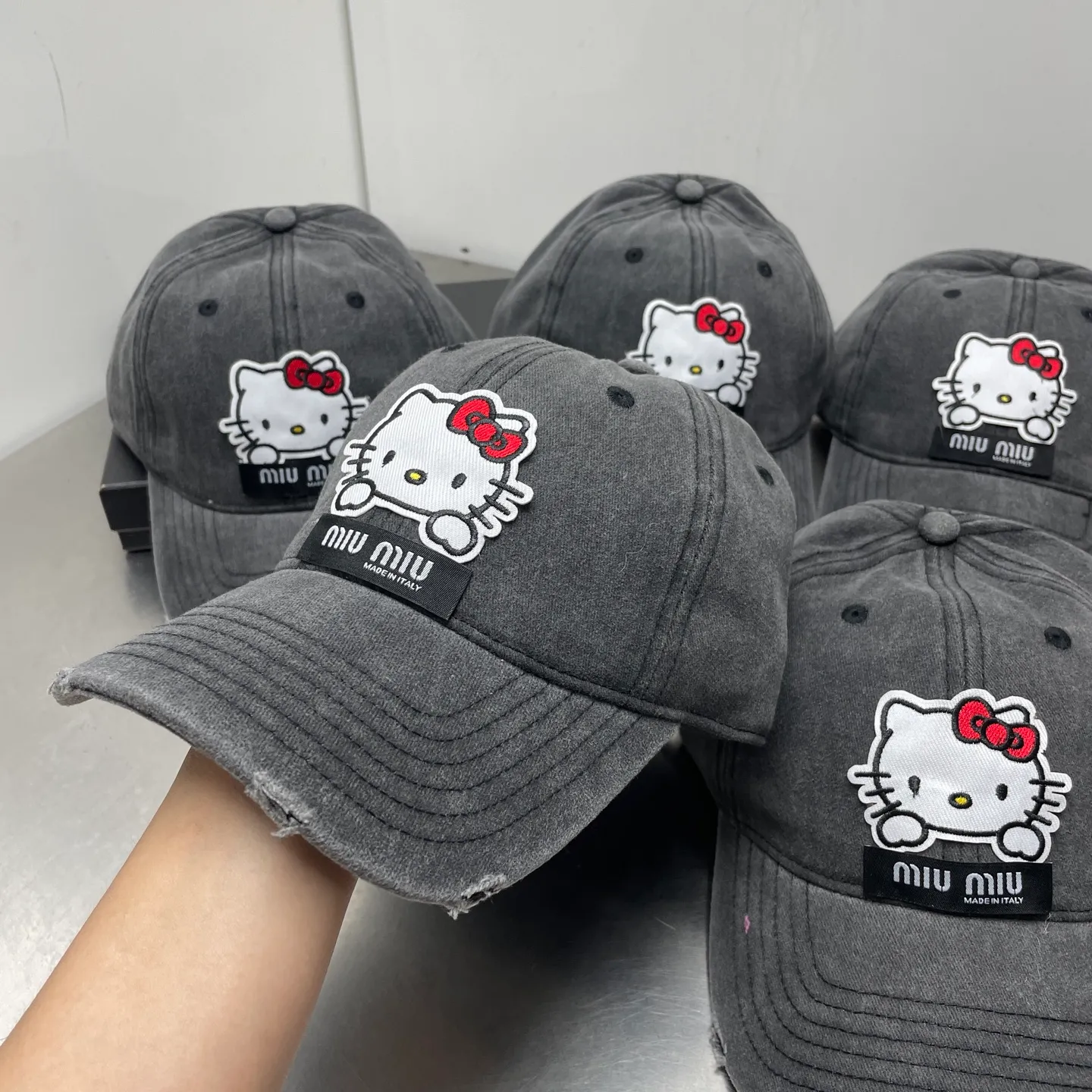 kitty Miumiu distressed hole baseball cap