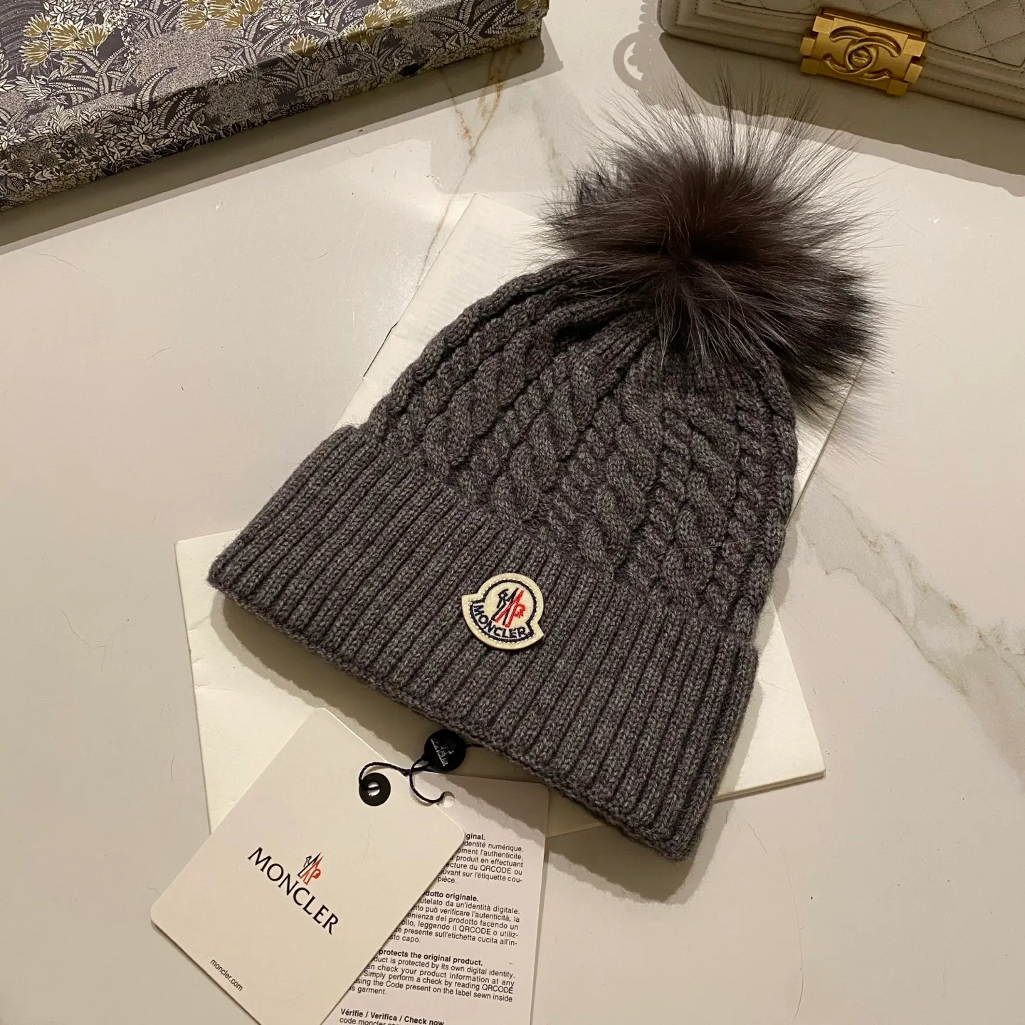Moncler Mouth Covered Cashmere Twist Knitted Hat + Black Fox Fur Ball