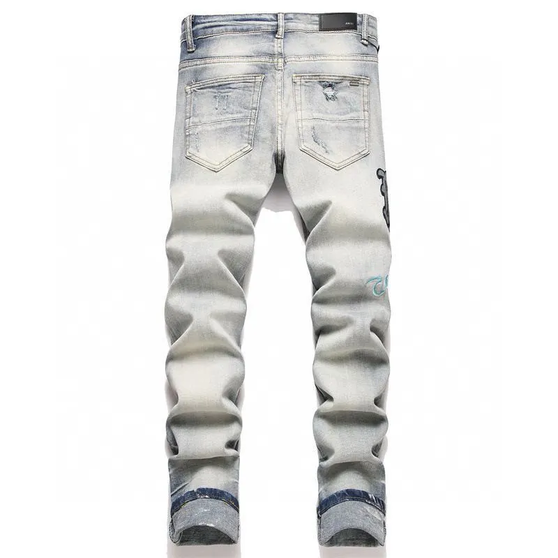 P180 Top replica AMIRI jeans trousers AMIRI high street basic ripped tight stretch jeans trousers Amiriamiri is transliterated as Emil, which is the name of the founder. Mike Amiri, the founder of amiri, grew up in Los Angeles, USA, and was influenced by the local street culture Rock since he was a child. Therefore, he founded the amiri brand named after himself. A variety of trendy clothing meets the needs of different fashion players. Amiri clothing has novel and unique styles and is a well-known street brand in the United States. Many of its styles and styles are loved by many street photographers. Various clothing styles meet the needs of different people, show their unique temperament, and show the trend of dressing. amiri's jeans are relatively famous. Not only do they have many styles, but the quality of the jeans is also very good. Many celebrities have also worn amiri brand jeans.  The jeans of the amiri brand break through the production process and cutting of the original jeans. The fabrics are relatively soft and comfortable, and are not as hard as some jeans, which can irritate the skin and cause the skin to bleed when worn. Los Angeles trendy brand Amiri's jeans are made with great detail from tailoring to texture, adding wrinkles, bullet holes, damage and other details to add to the trendiness of the jeans. You can choose the style that suits you according to your own needs. Only when you wear a suitable style can you have a certain sense of fashion.  In recent years, high street has become a word that appears more and more frequently in men's clothing. High street style has also become an important direction for everyone's matching. High street related items are basically inseparable from oversize or off-shoulder tops. The lower body is matched with trackpants or tight-fitting denim. In my opinion, the most representative one is perhaps annihilation. Color; picture color Size: m l xl xxl