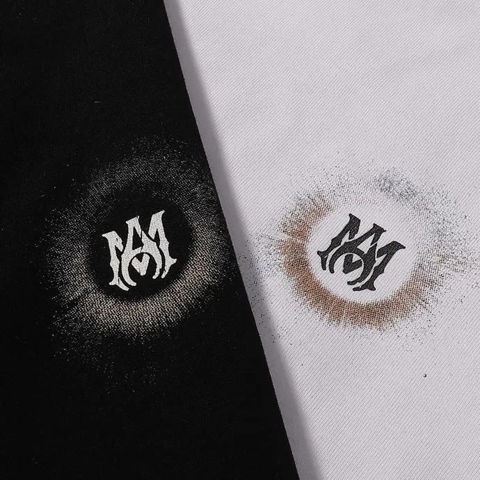 Style number: 725 P126 Fabric: 260g double yarn AMIRI 2025 spring and summer new logo round neck T-shirt high street unisex loose classic letter sun black hole star short sleeve Color: black. White Size: S M L XL