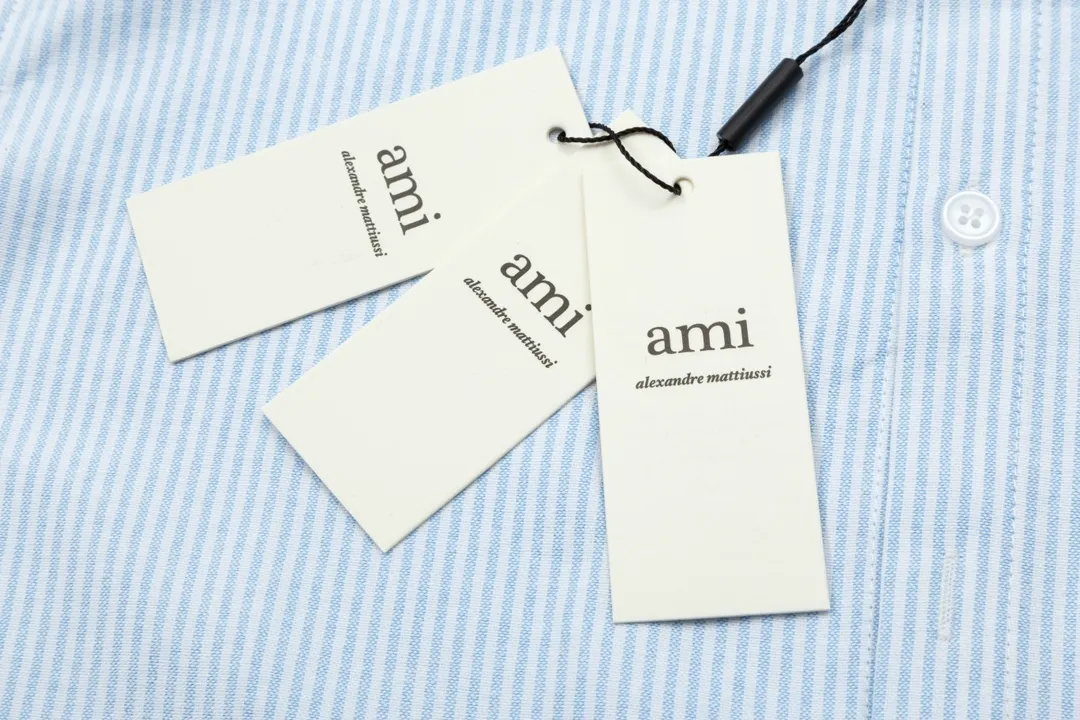 2202# AMI Paris Classic autumn red small heart embroidered on the chest Casual cotton striped long-sleeved Oxford shirt Original custom-made 180g pure cotton fabric Regular version Same style for men and women Colors: Black and white Gray and white Blue and white Green and white Pink and white Size: S-XL
