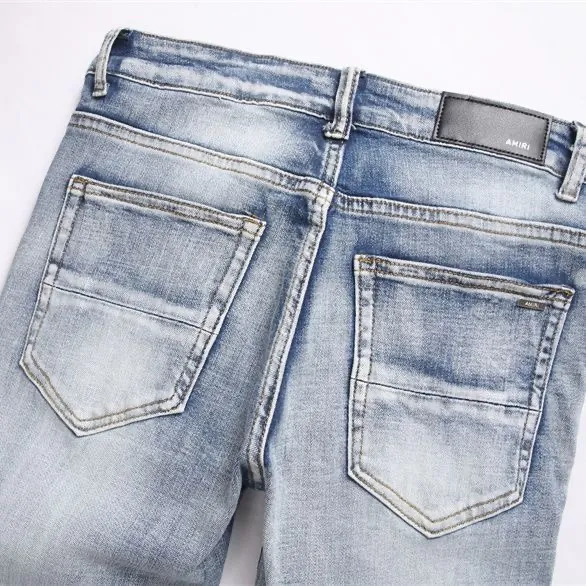 P186 💰 AMIRI patch embroidery jeans trousers AMIRI high street basic ripped tight elastic jeans trousers amiri brand jeans break the production process and cutting of the original jeans, the fabrics are softer and more comfortable Hand-sewn collar label Customized logo buttons Genuine leather tag Color: Picture color Size: 30-32-34-36