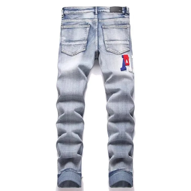 P168 💰 AMIRI patch embroidery jeans trousers AMIRI high street basic ripped tight elastic jeans trousers amiri brand jeans break the production process and cutting of the original jeans, the fabrics are softer and more comfortable Hand-sewn collar label Customized logo buttons Genuine leather tag Color: Picture color Size: 30-32-34-36