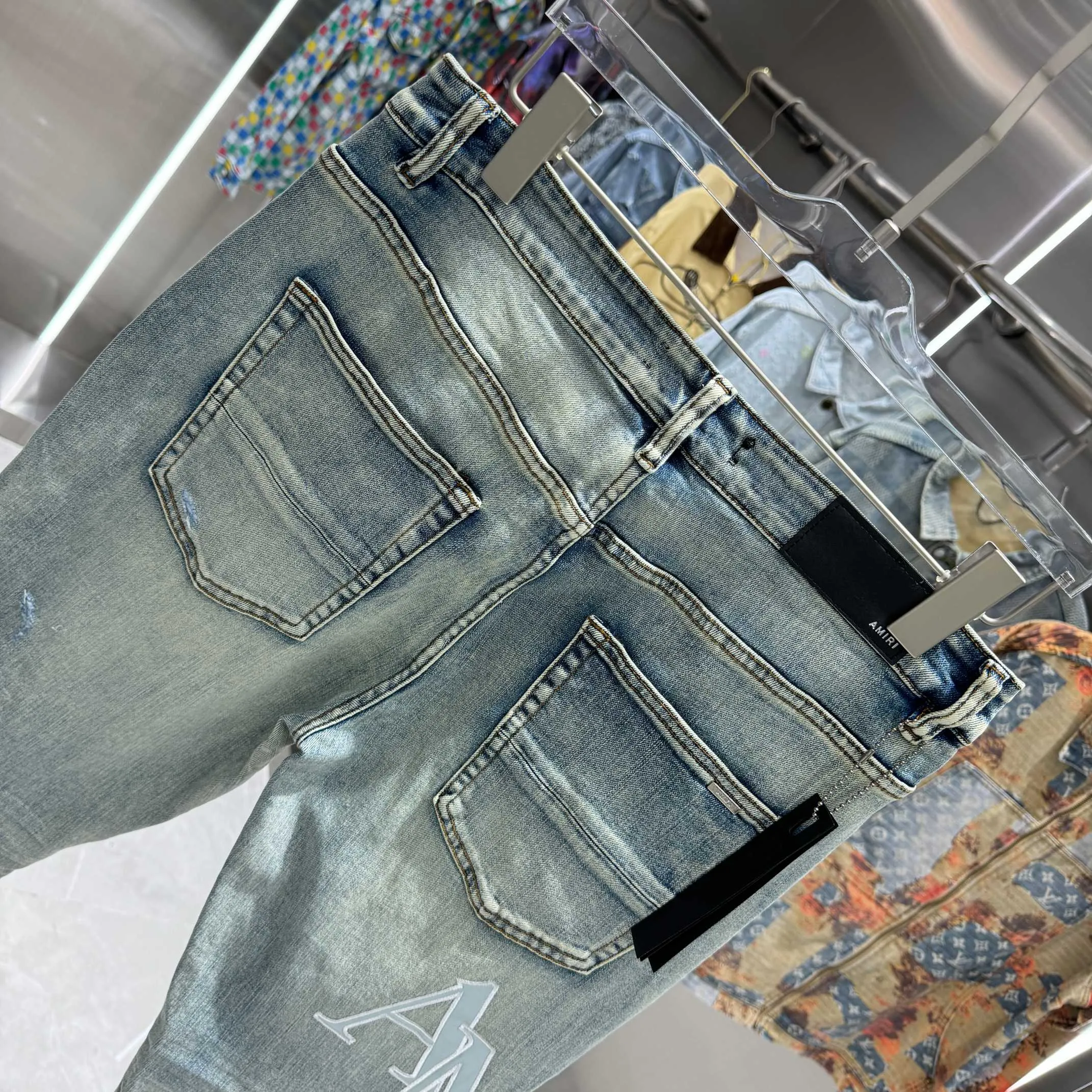 P290 Amiri ripped letter embroidery craft street fashion slim fit stretch jeans color blue size 30 32 34 36 38