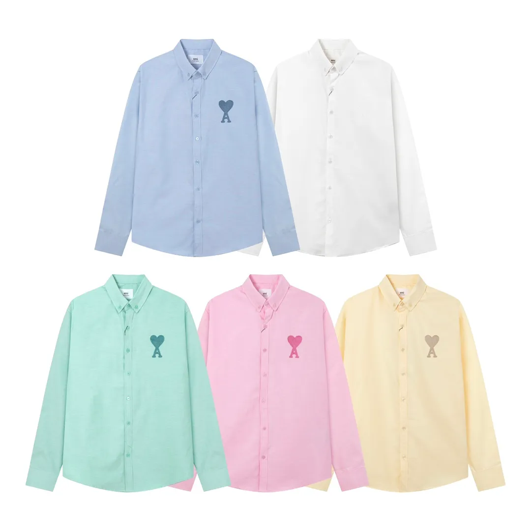 2205# AMI Paris Classic Autumn Towel embroidered with hearts in the same color on the chest Casual cotton solid color long-sleeved Oxford shirt Original customized 180g pure cotton fabric Regular version Same style for men and women Color: White Blue Yellow Aqua Pink Size: S-XL