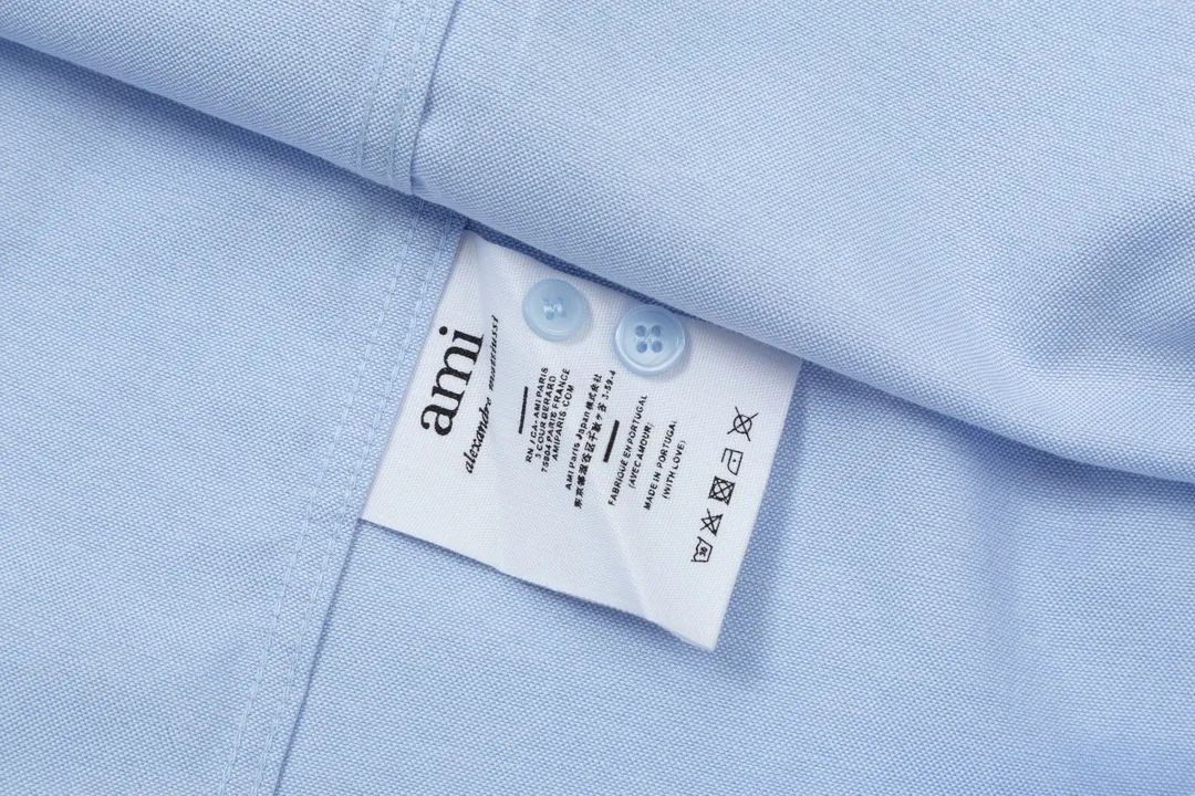 2205# AMI Paris Classic Autumn Towel embroidered with hearts in the same color on the chest Casual cotton solid color long-sleeved Oxford shirt Original customized 180g pure cotton fabric Regular version Same style for men and women Color: White Blue Yellow Aqua Pink Size: S-XL