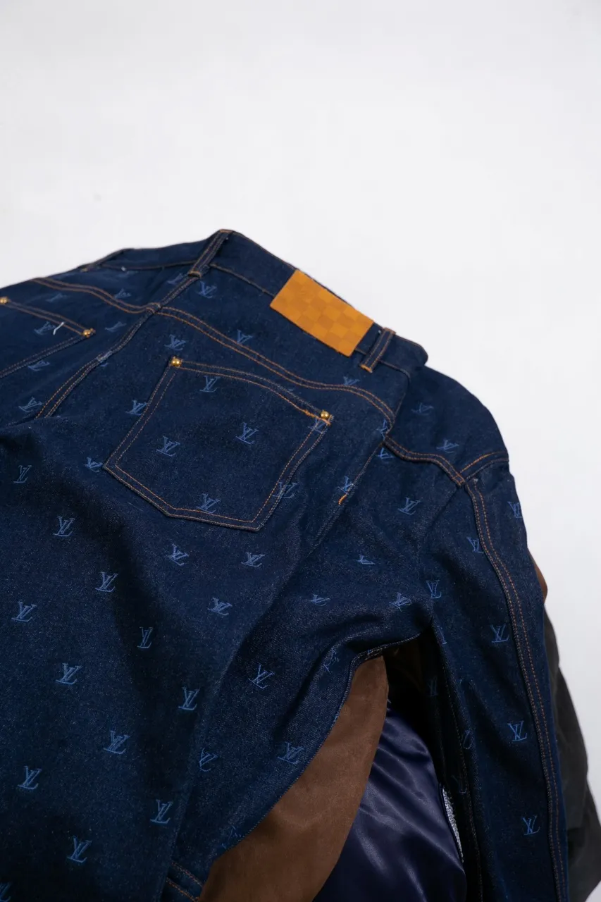 LV Embroidered Jeans This pair of jeans is made of original washed denim, with an all-over LV Blason pattern embroidered with fine yarn. The classic silhouette is finished with a Damier nubuck label and LV metallic accents, making it a sophisticated addition to the matching jacket.  Standard fit All-over LV Blason embroidered Damier nubuck label with LV metallic accents