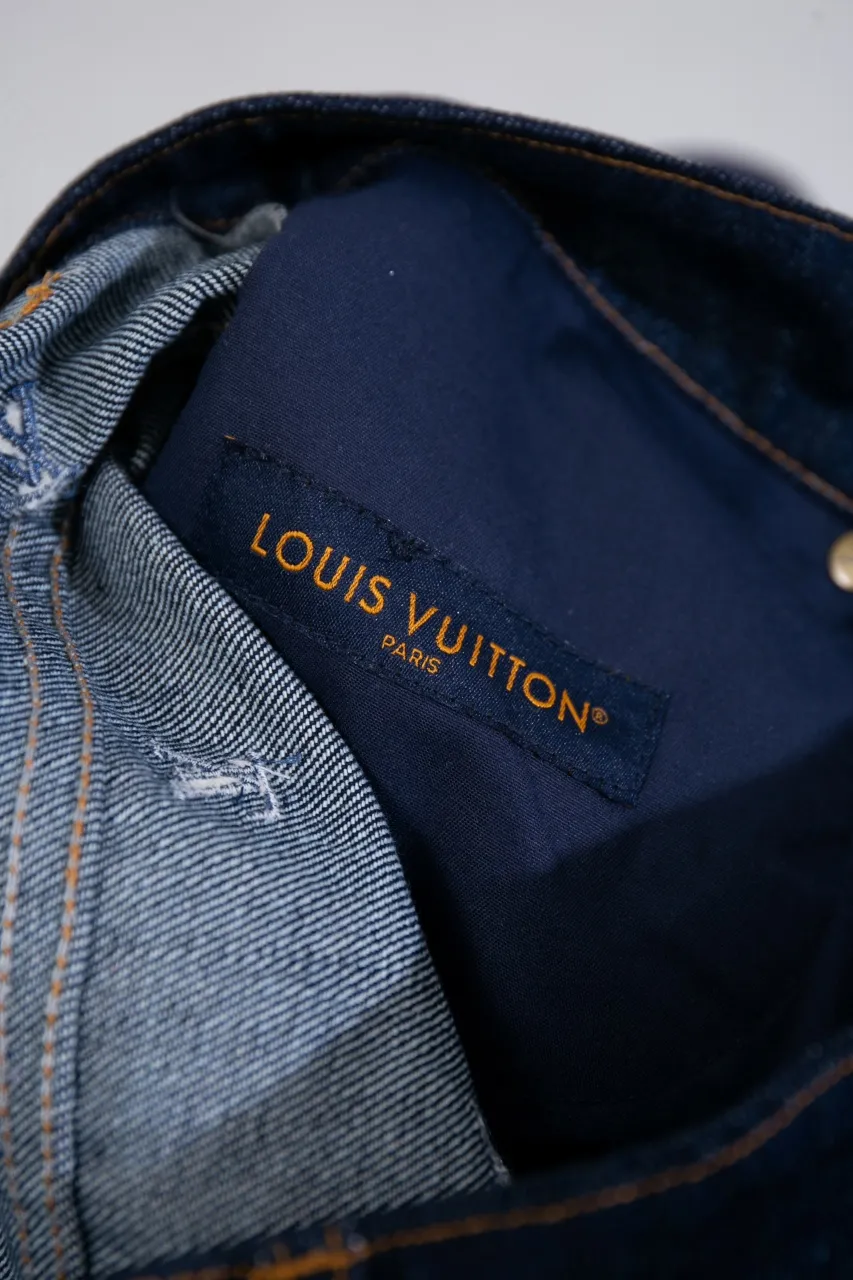 LV Embroidered Jeans This pair of jeans is made of original washed denim, with an all-over LV Blason pattern embroidered with fine yarn. The classic silhouette is finished with a Damier nubuck label and LV metallic accents, making it a sophisticated addition to the matching jacket.  Standard fit All-over LV Blason embroidered Damier nubuck label with LV metallic accents
